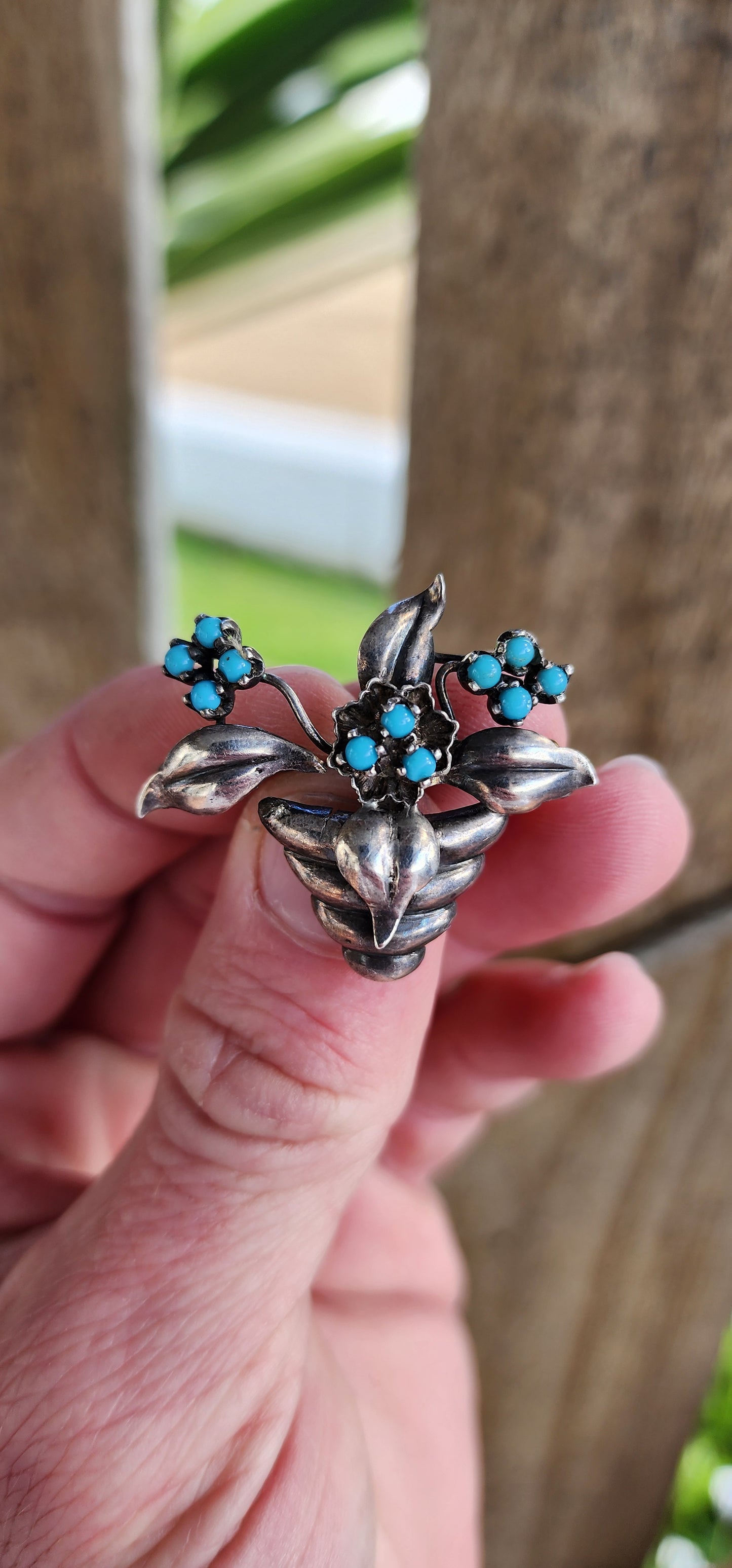 Vintage 800 Silver and Turquoise Cabochons pot plant brooch with flowers and leaves , the flowers each studded with small Turquoise Cabochons in prong settings.