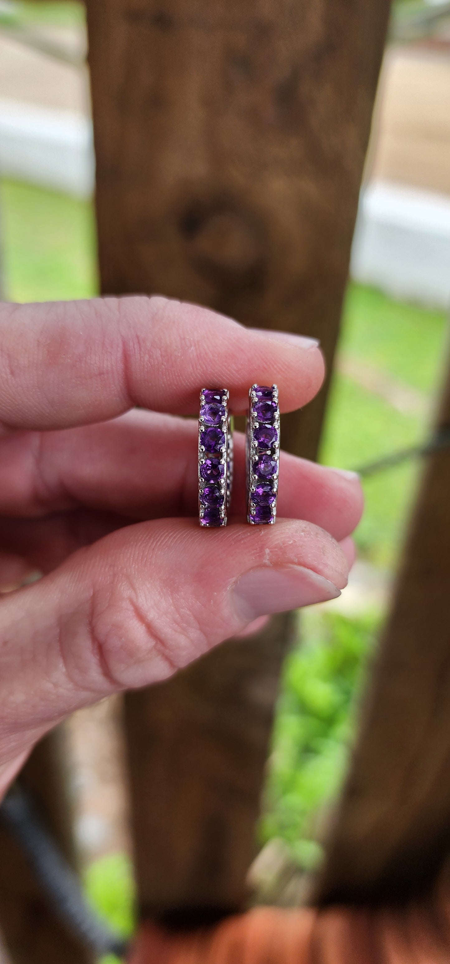 Gorgeous pair of Sterling Silver and Purple Amethyst Gemstones Huggies/Hoop earrings .Each earring set with 10x Round Faceted Cut Amethyst Gemstones.