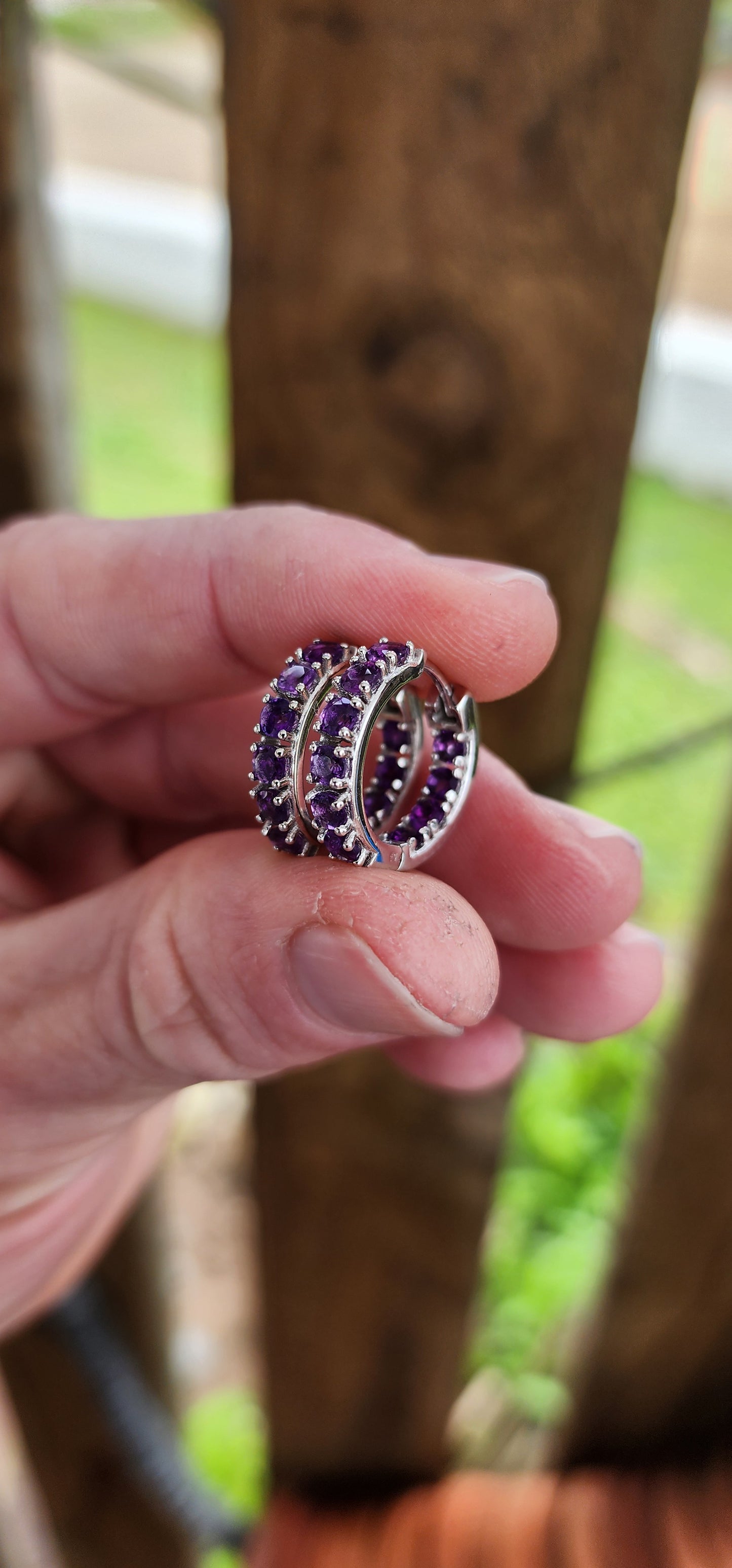 Gorgeous pair of Sterling Silver and Purple Amethyst Gemstones Huggies/Hoop earrings .Each earring set with 10x Round Faceted Cut Amethyst Gemstones.