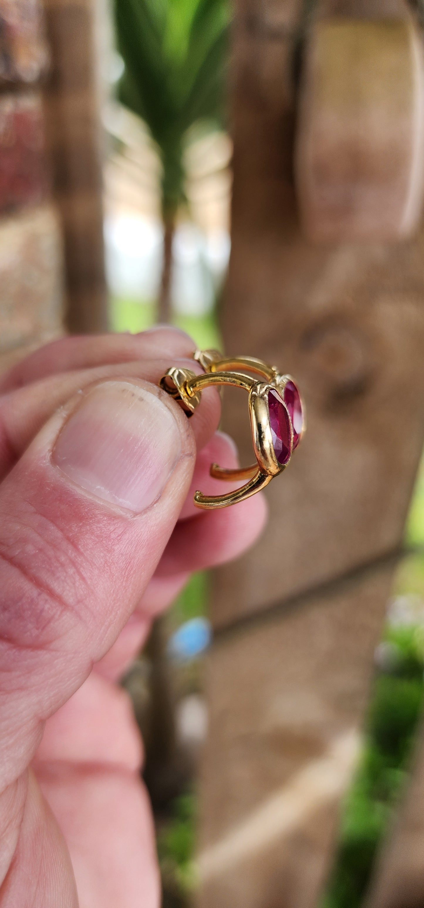 Modernist in style pair of Sterling Silver with 18ct Yellow Gold plating half hoop stud earrings - Each earring bezel/tube set with a generous in size Oval faceted cut Red Rubellite Tourmaline Gemstone.