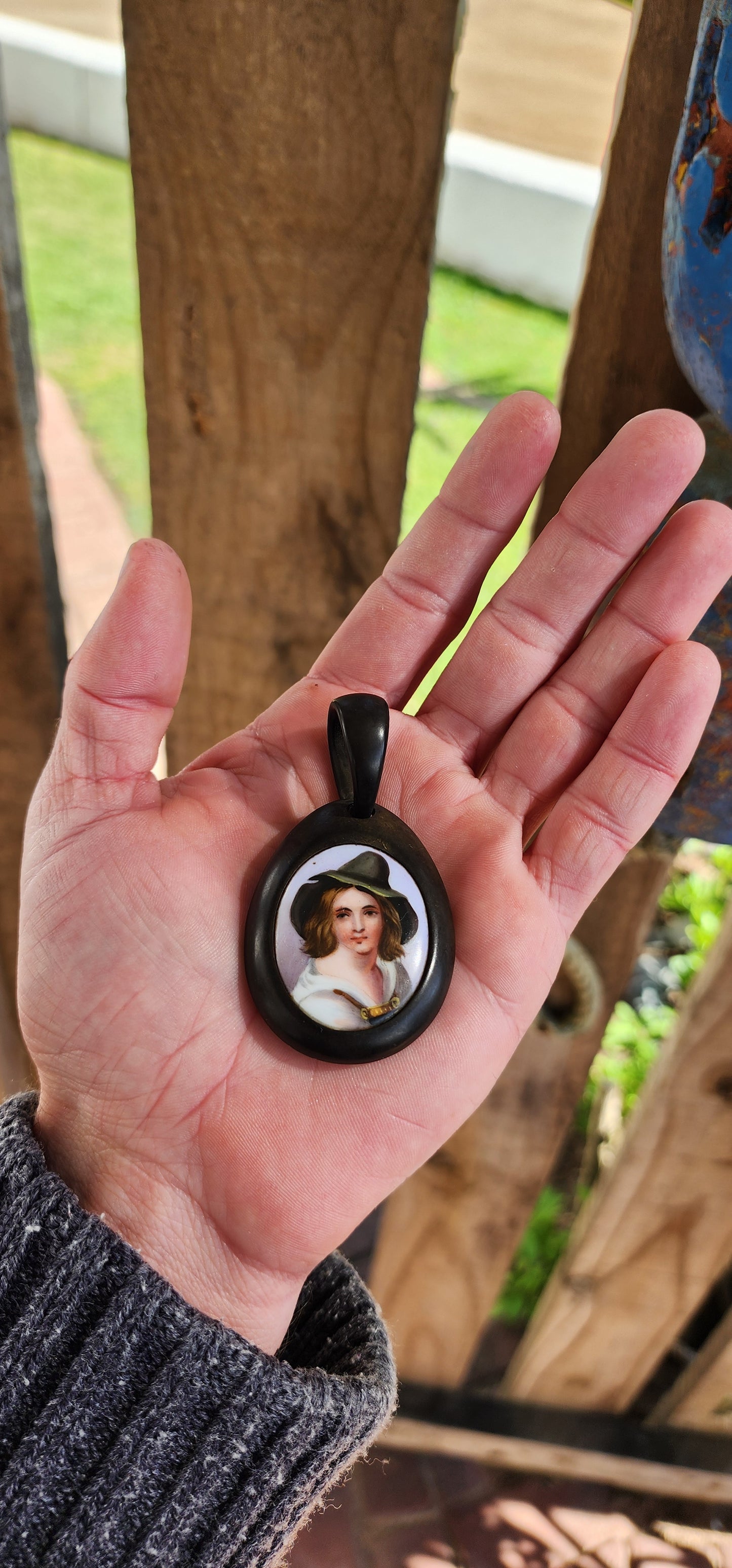 Antique Victorian circa 1890's Vulcanite and hand painted porcelain pendant.
The very detailed hand painted portrait featuring a Tyrolean Boy with Green hat.