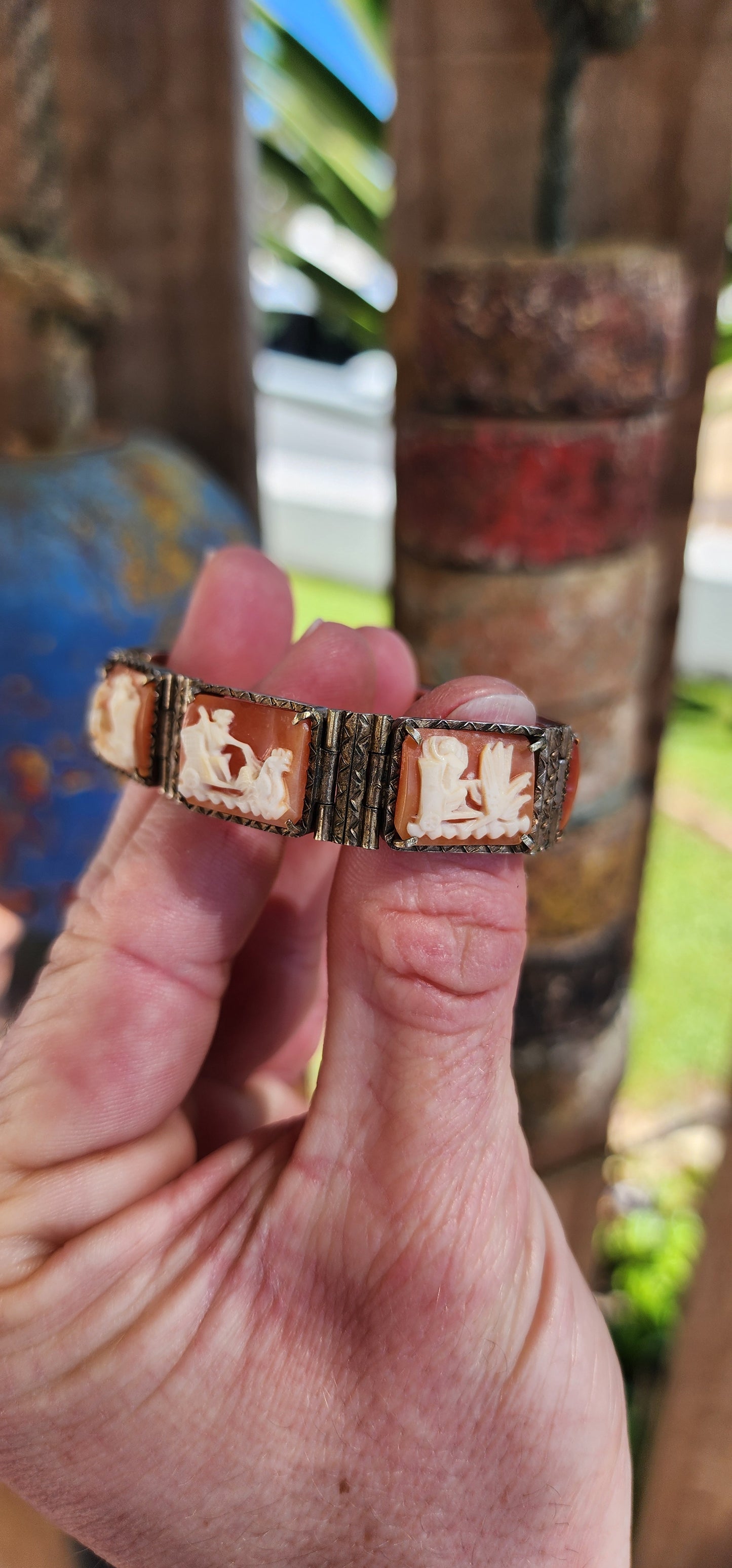 An extraordinary and rare Antique Victorian  Italian Sardonyx Cameo Mythology 7-panel bracelet. Hand-carved and in a lovely 800 silver setting, this bracelet features stunning scenes of Roman gods racing chariots representing the days of the week.