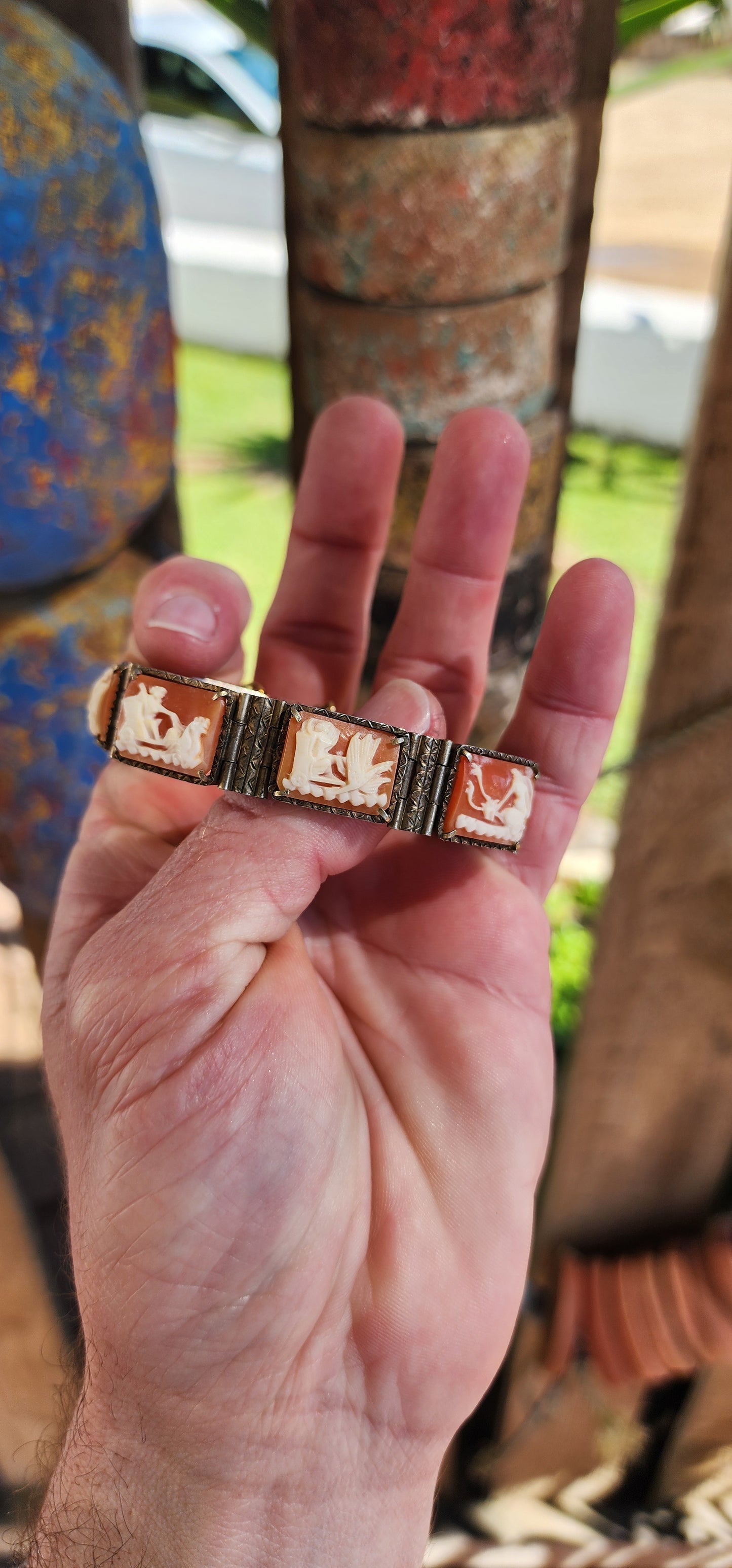 An extraordinary and rare Antique Victorian  Italian Sardonyx Cameo Mythology 7-panel bracelet. Hand-carved and in a lovely 800 silver setting, this bracelet features stunning scenes of Roman gods racing chariots representing the days of the week.