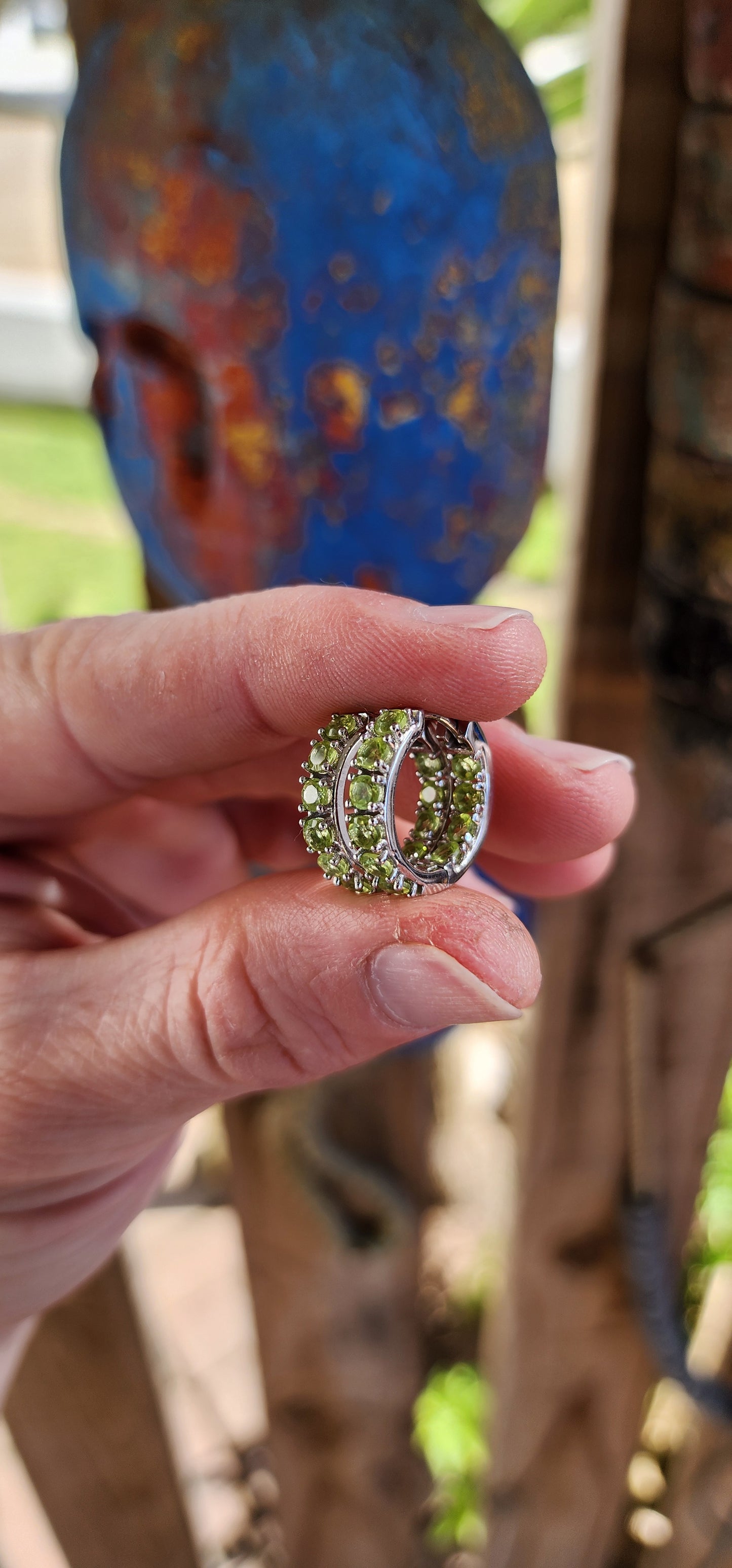 Gorgeous pair of Sterling Silver and Green Peridot Gemstones Huggies/Hoop earrings .Each earring set with 10x Round Faceted Cut Peridot Gemstones.