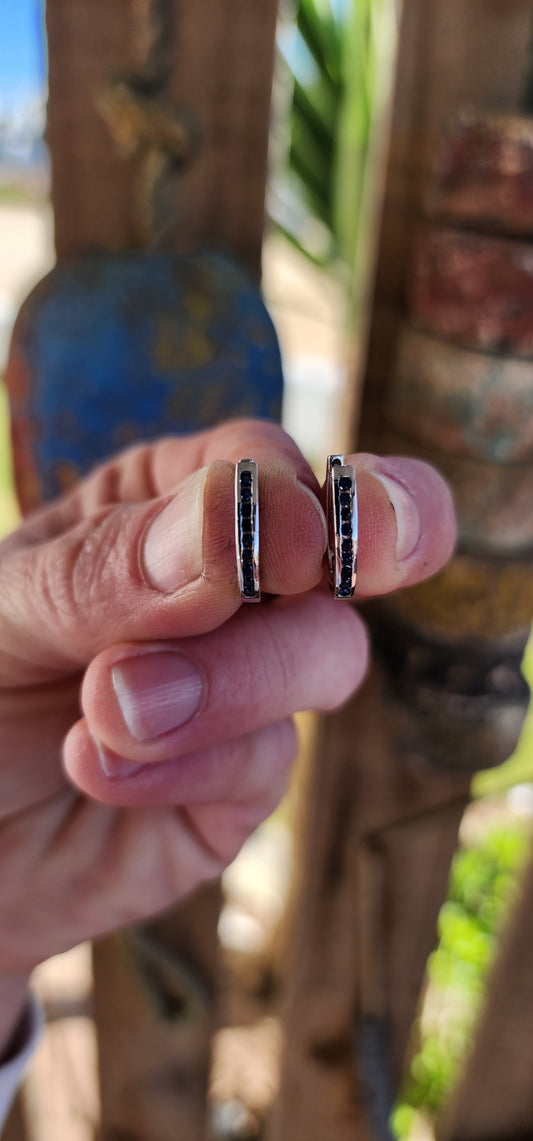 Minimalistic beauties!These Channel set Blue Sapphire and Sterling Silver Oval shaped Huggies are the perfect piece to add an edge to your everyday outfit.They are designed to hug your ear and are comfortable enough for everyday wear.