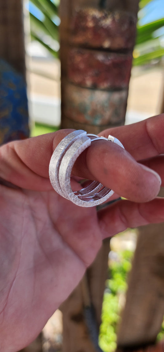 A must have for every jewellery box! Trusty pair of chunky Sterling Silver Hoop earrings. Featuring a lovely textured/scratched look which catches the light beautifully.