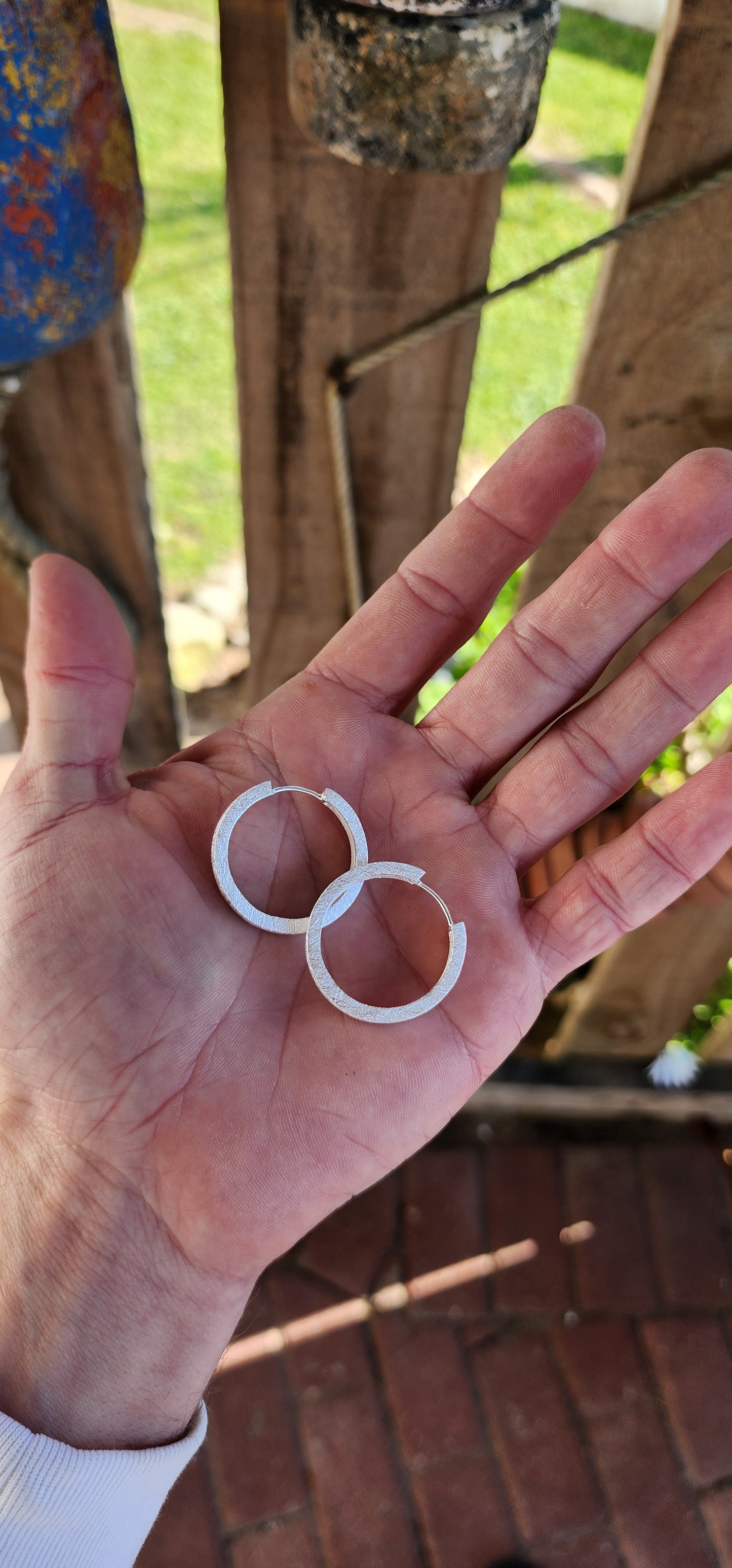 A must have for every jewellery box! Trusty pair of chunky Sterling Silver Hoop earrings. Featuring a lovely textured/scratched look which catches the light beautifully.