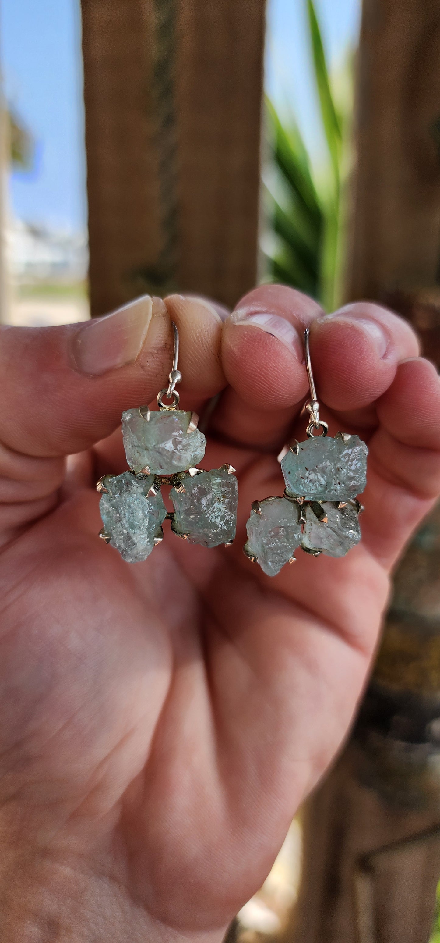 One of a kind beauties! These fabulous and unusual Sterling Silver dangle earrings are prong set with clusters of raw/rough Aquamarine specimens .