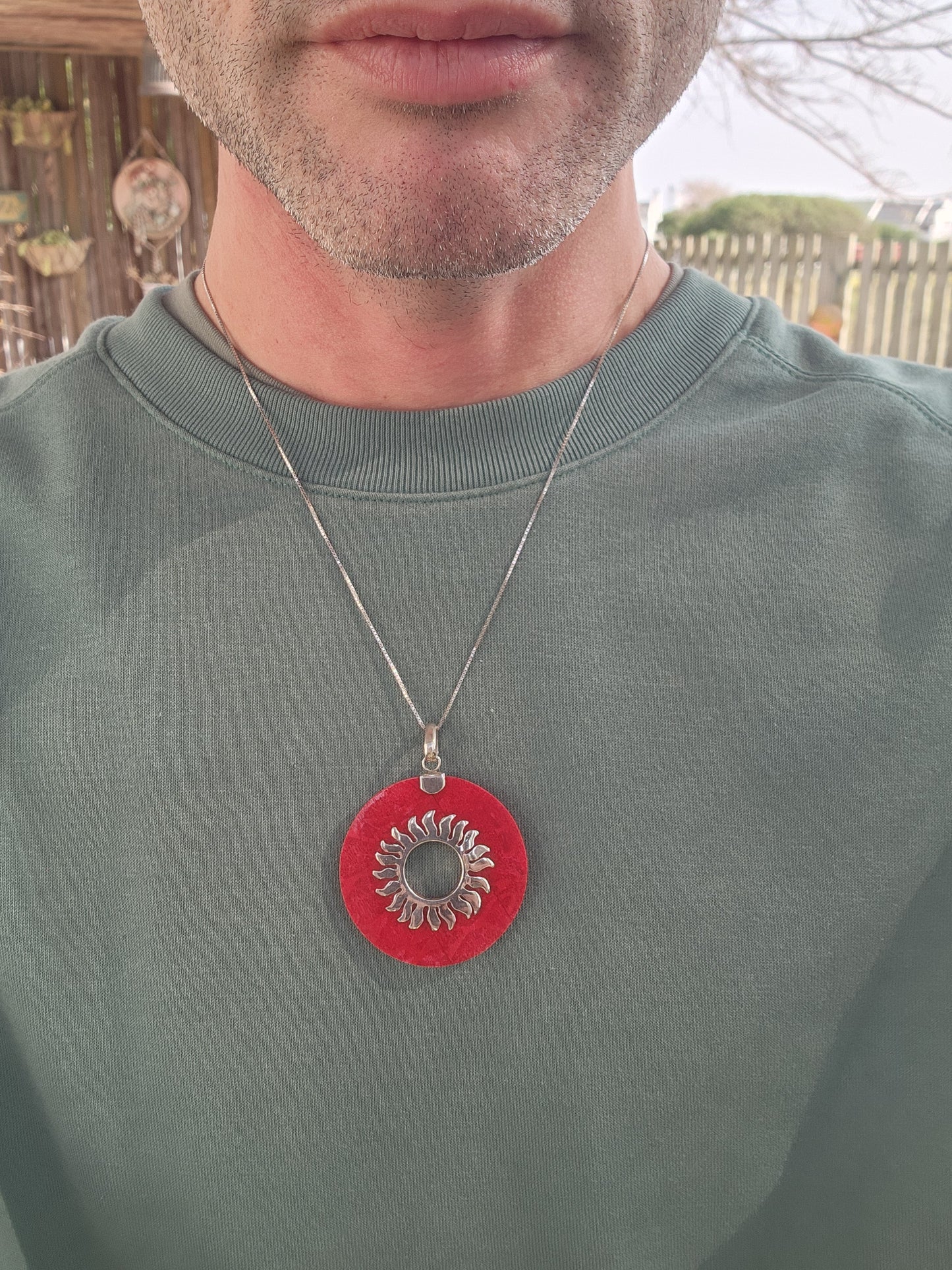 Beautiful and large sized Sterling Silver and Red Sponge Coral Circular Pendant - The open centre decorated with a Sterling Silver Sunburs pattern.
The pendant comes fitted on a extra length Sterling Silver box chain.