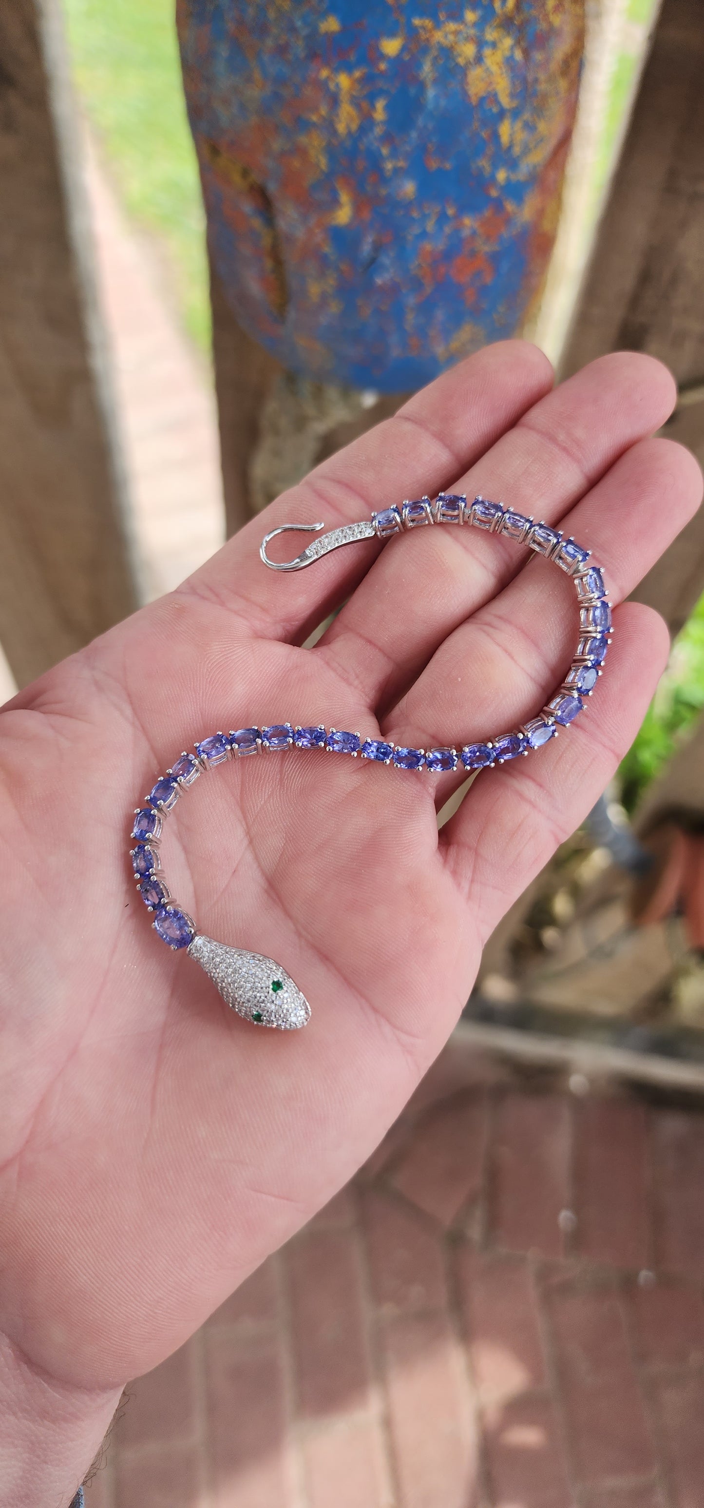 Incredible Serpent bracelet is a real piece of jewelry art! The bracelet is made of high quality Sterling Silver and Natural Oval cut Tanazanite Gemstones.