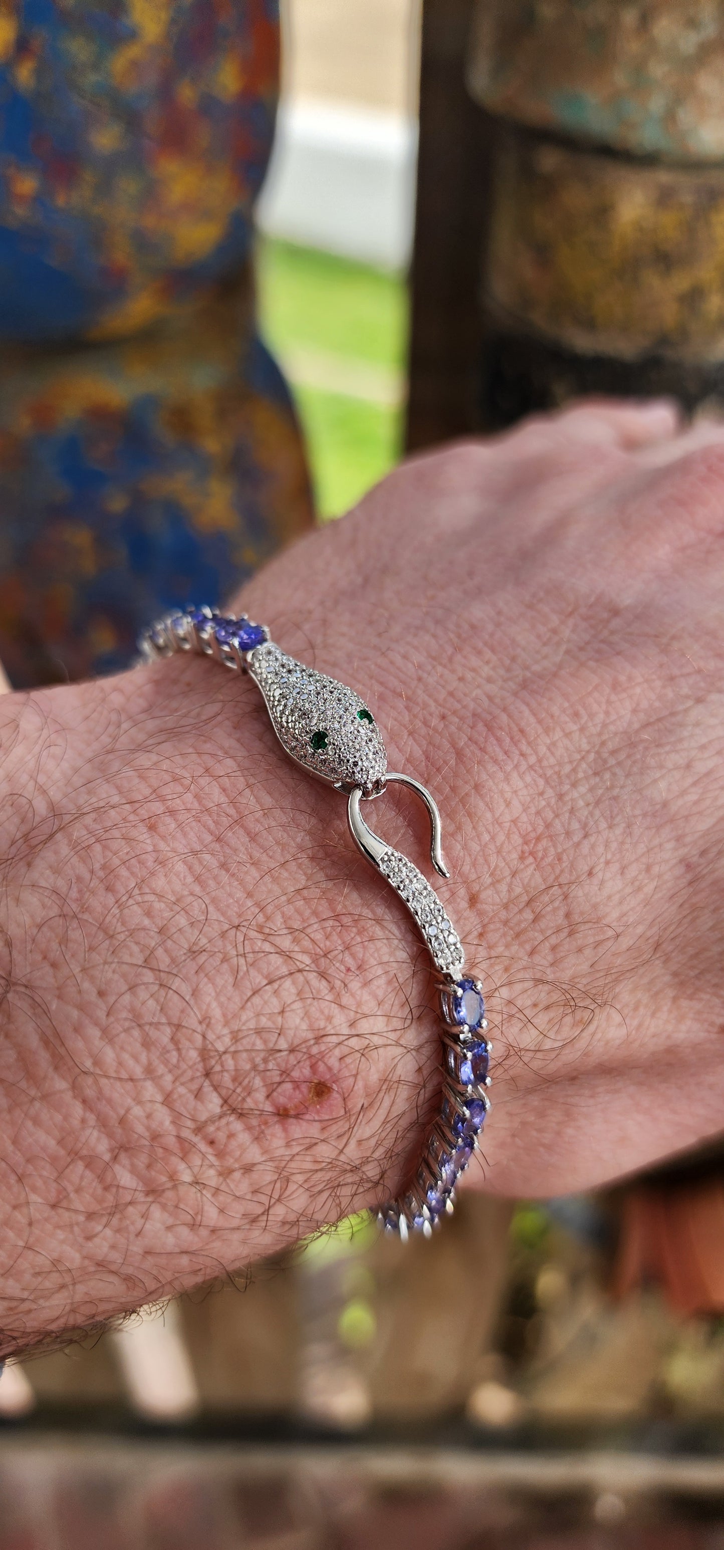 Incredible Serpent bracelet is a real piece of jewelry art! The bracelet is made of high quality Sterling Silver and Natural Oval cut Tanazanite Gemstones.