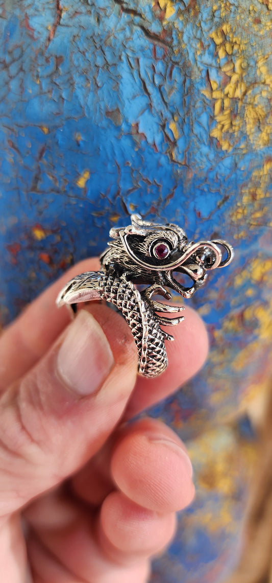 This chunky statement Sterling Silver Red Eye Dragon Novelty Ring draws inspiration from Oriental and Gothic styles, making it a truly eye-catching beauty.