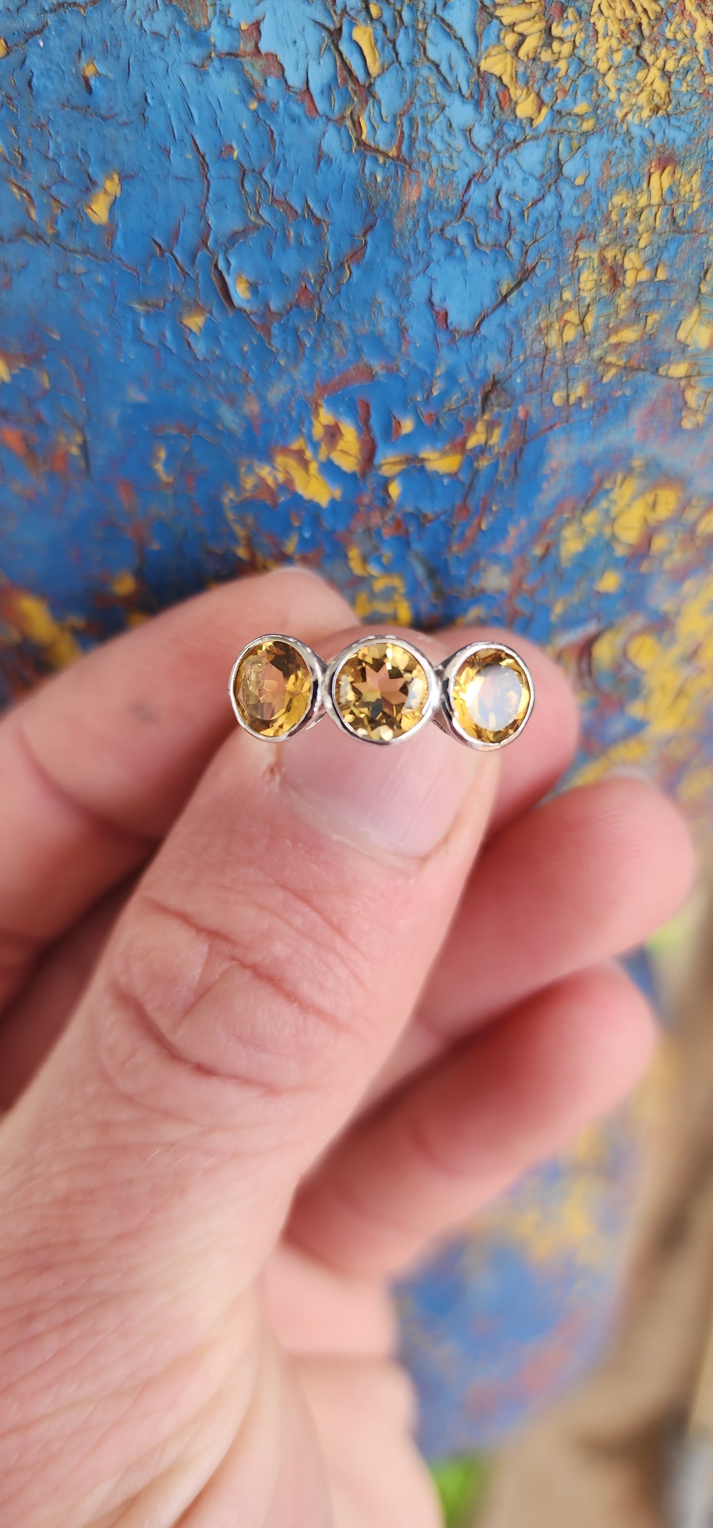 Gorgeous Sterling Silver and Yellow Citrine Gemstones Trilogy ring .This exquisite ring features three Round faceted cut Yellow Citrine Gemstones, bezel/tube set in pierced baskets.