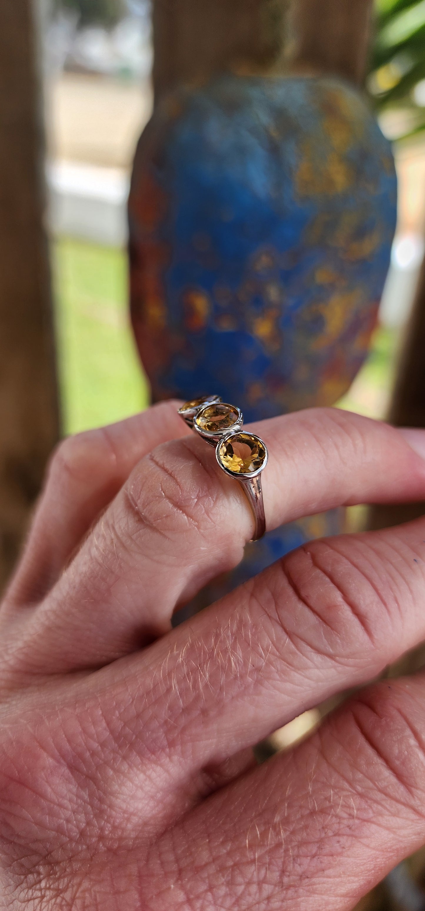 Gorgeous Sterling Silver and Yellow Citrine Gemstones Trilogy ring .This exquisite ring features three Round faceted cut Yellow Citrine Gemstones, bezel/tube set in pierced baskets.