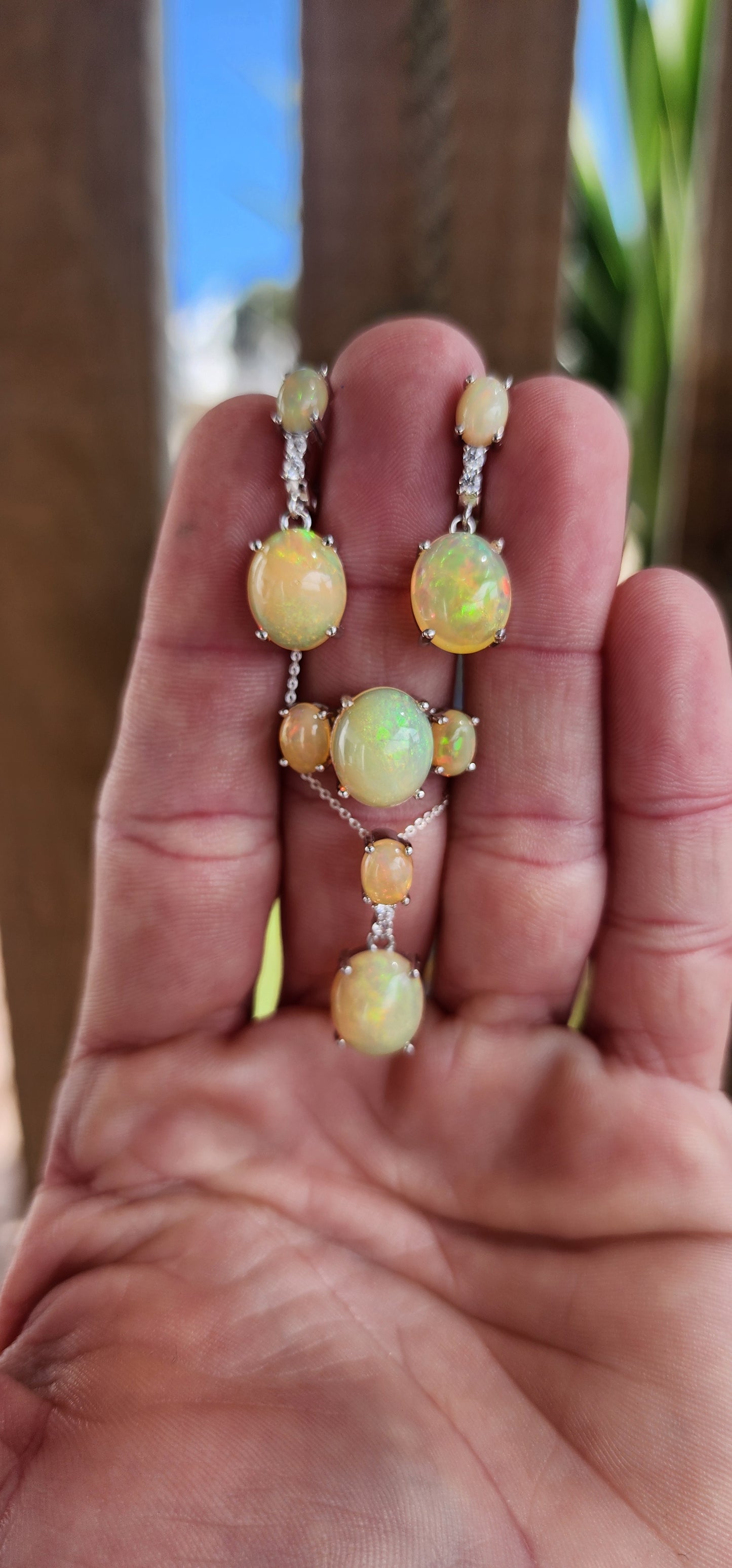 Stunning pair of Sterling Silver and Orange Ethiopian Welo Opal Cabochons and CZ Gemstones push-in earrings .These earrings from part of a matching set consisting out of Trilogy ring , earrings and pendant on chain .All Sold separately.