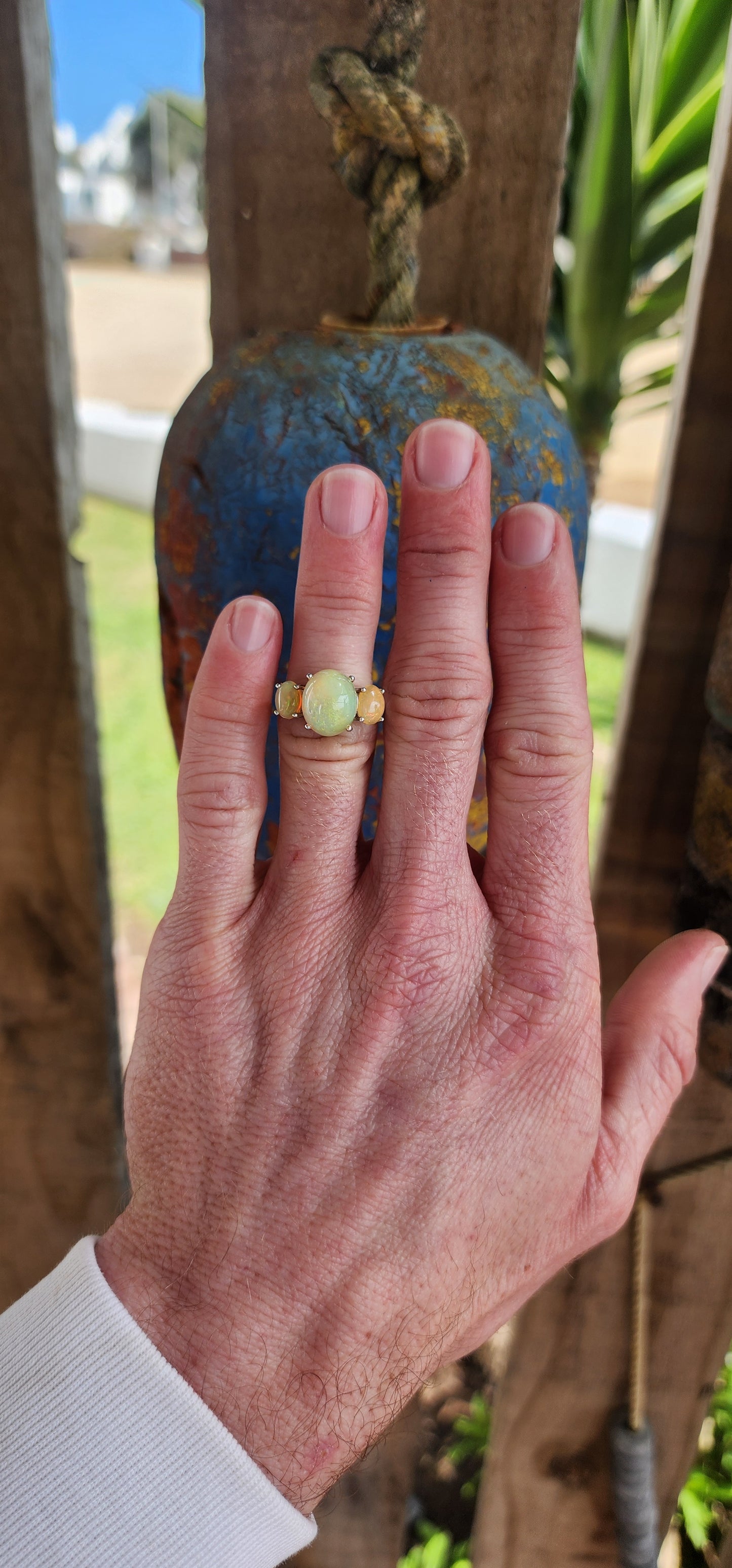 Marvelous Sterling Silver and Orange Ethiopian Welo Opal Cabochons Trilogy ring.This ring forms part of a matching set consisting out of Trilogy ring , earrings and pendant on chain .All Sold separately.