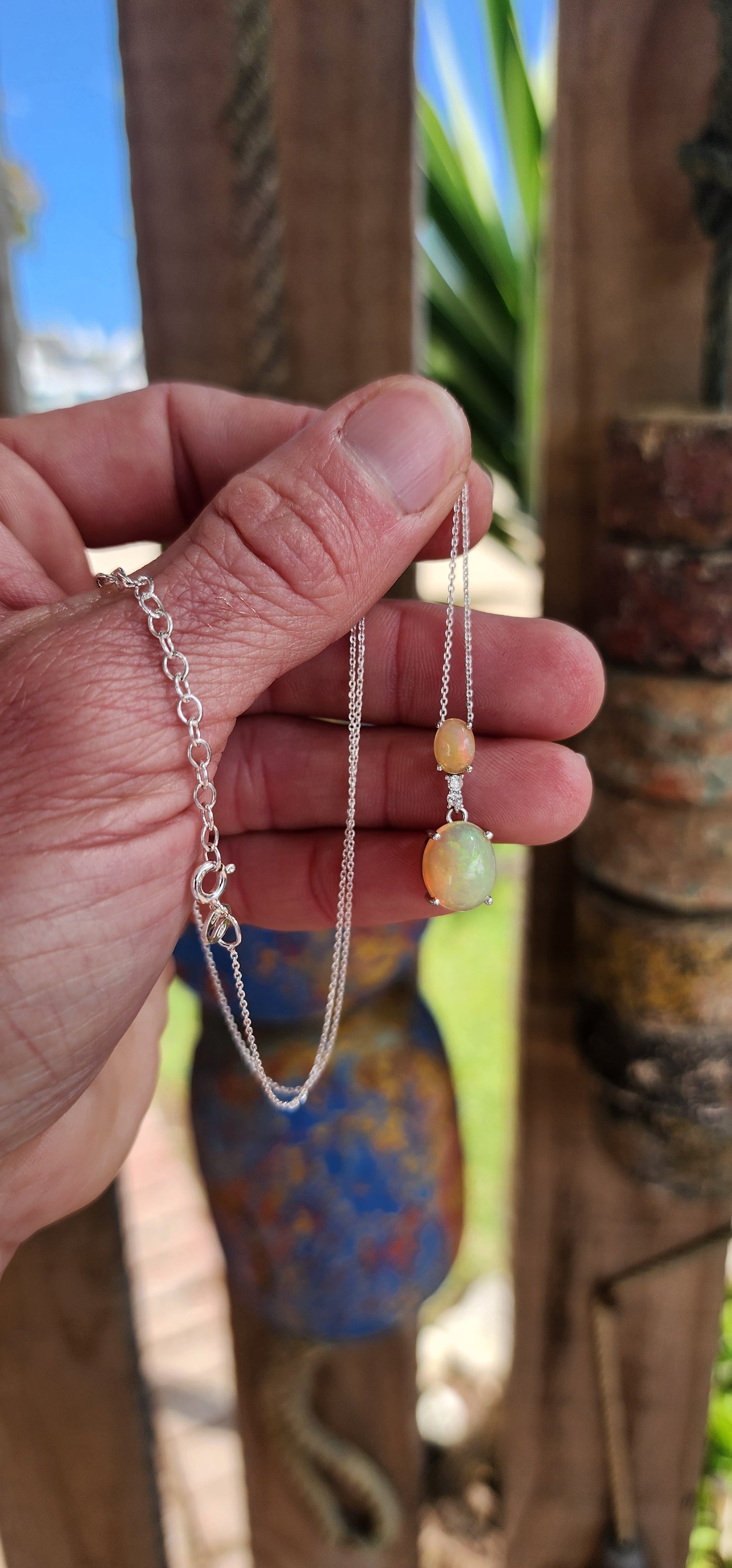 Beautiful Sterling Silver , Orange Ethiopian Welo Opal Cabochons and CZ Gemstones pendant fitted on a adjustable length chain .This pendant/chain forms part of a matching set consisting out of Trilogy ring , earrings and pendant on chain .All Sold separat