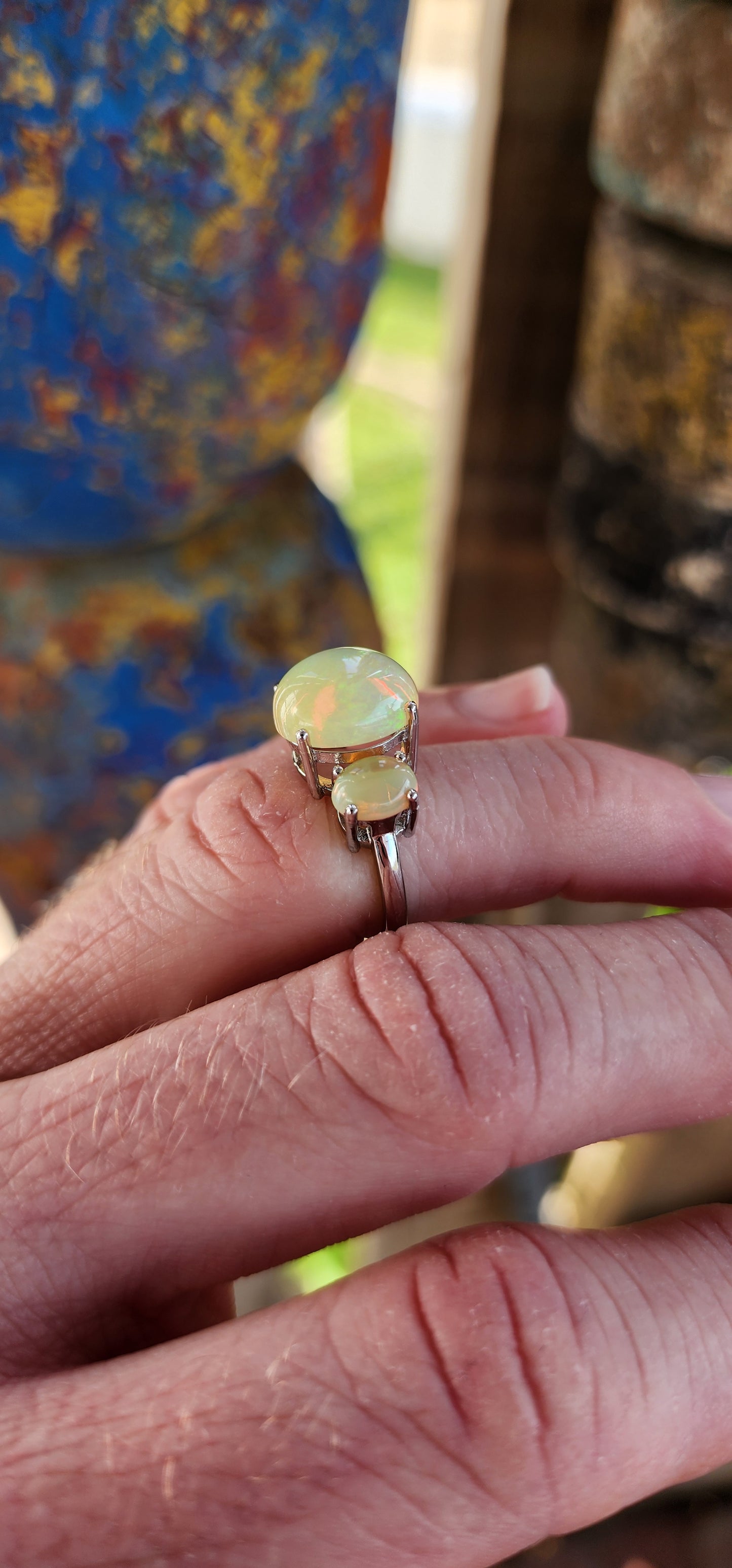 Marvelous Sterling Silver and Orange Ethiopian Welo Opal Cabochons Trilogy ring.This ring forms part of a matching set consisting out of Trilogy ring , earrings and pendant on chain .All Sold separately.