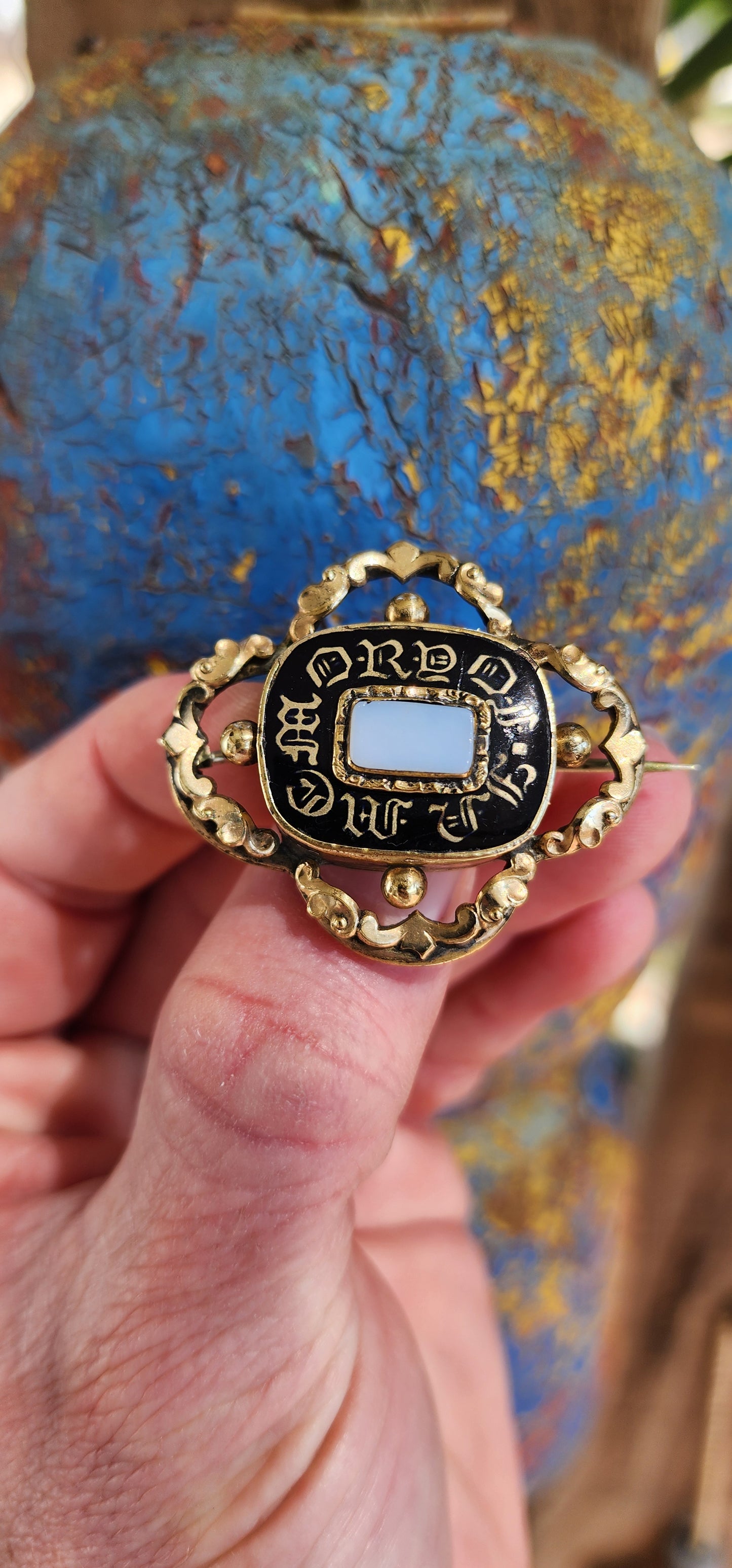 A poignant Antique Mourning brooch dating to the early years of the 19th century and in the Rococo style which was having a revival at the time.