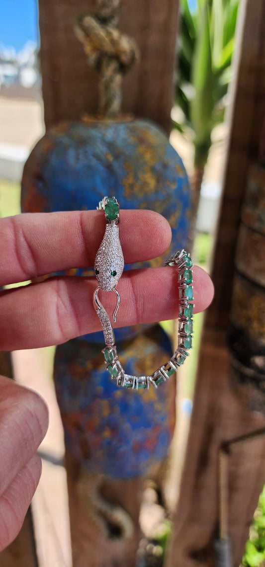 Thia incredible Serpent bracelet is a real piece of jewelry art! The bracelet is made of high quality Sterling Silver and Natural Oval cut Emerald Gemstones.