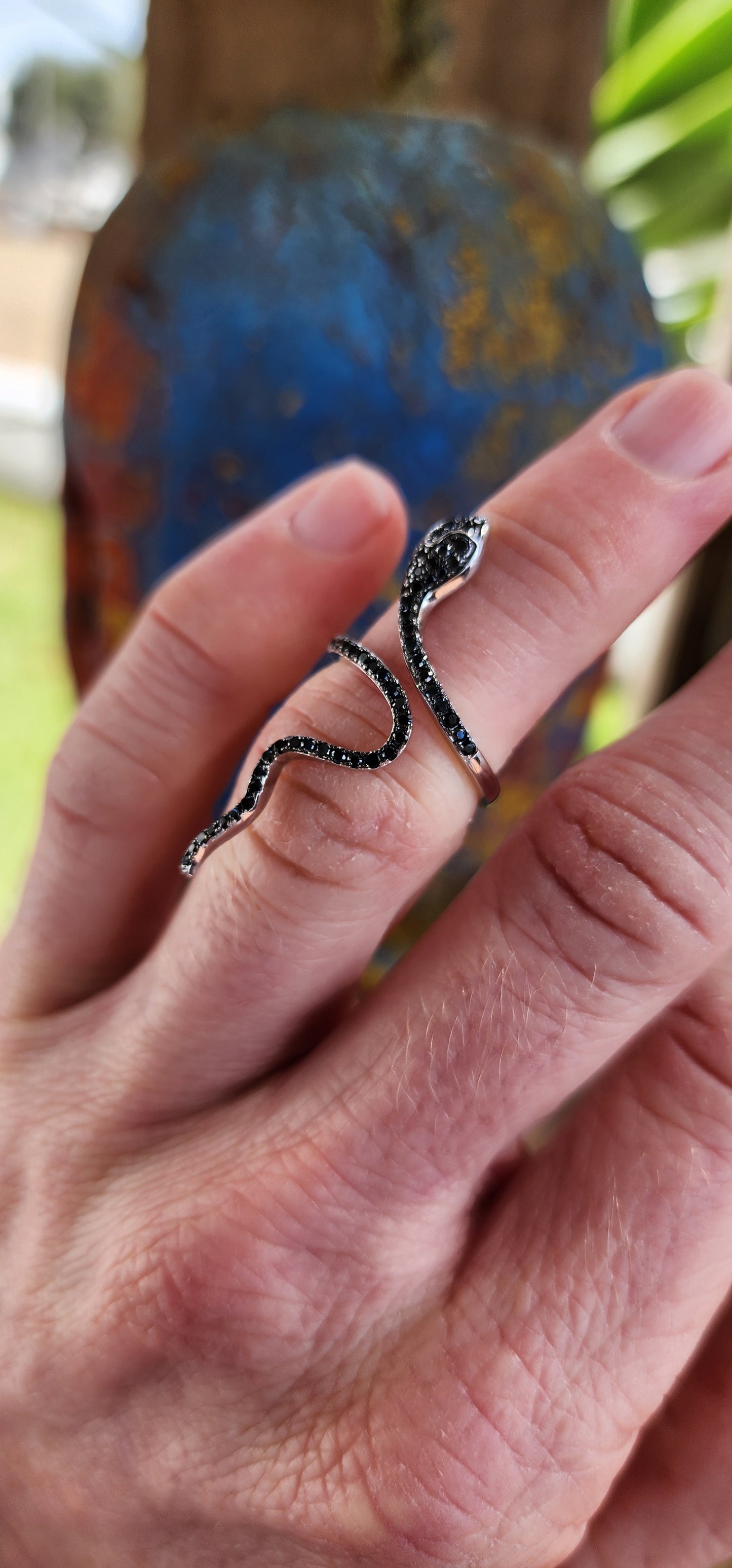 Magical and inimitable Sterling Silver coiling Serpent ring.The Serpent is adorned with pave Black Spinel Gemstones, adding a magical sparkle to its eyes and body.