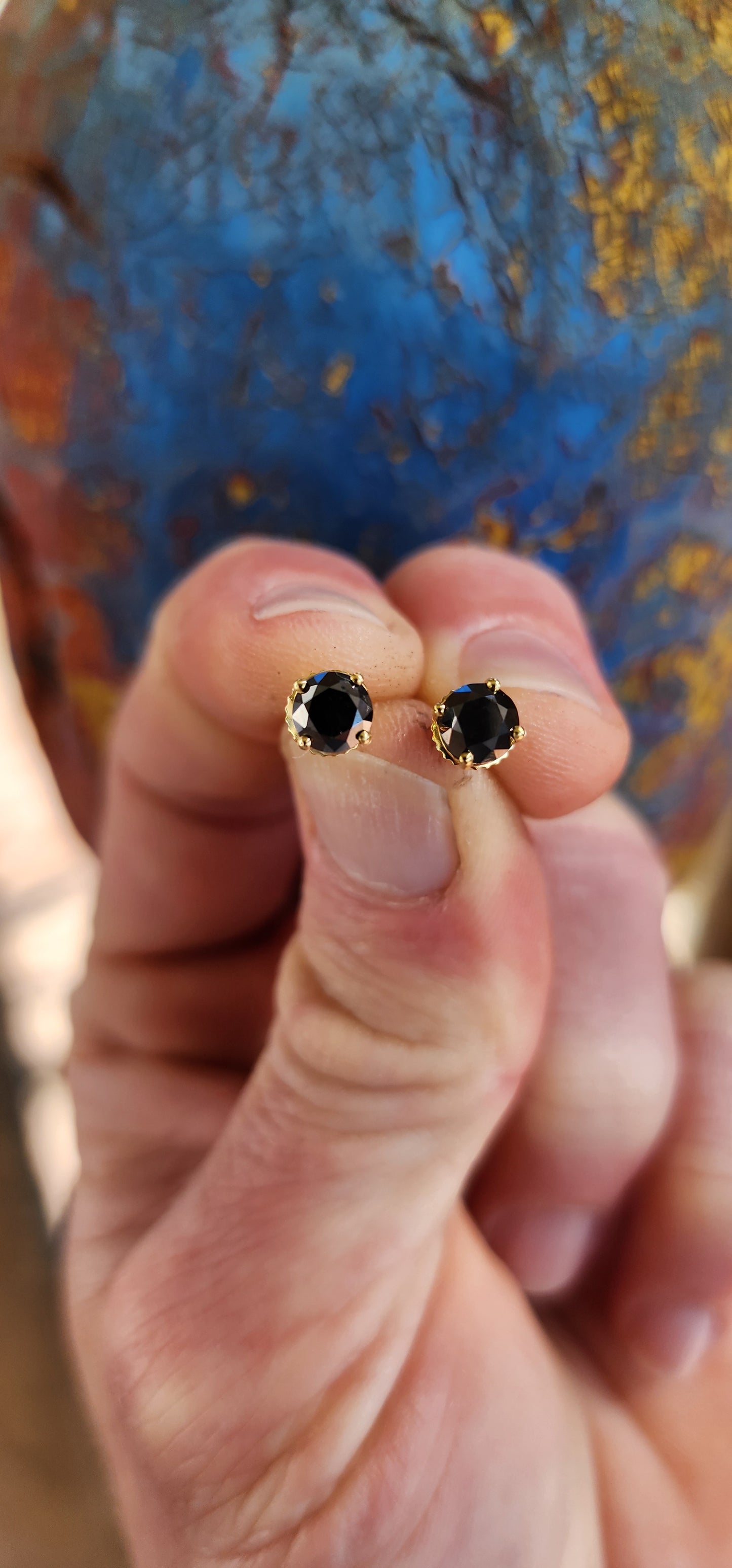 These stunning 9ct Yellow Gold and Round cut Black Diamond Solitaire stud earrings are a perfect blend of elegance and sophistication, designed to make a bold statement.