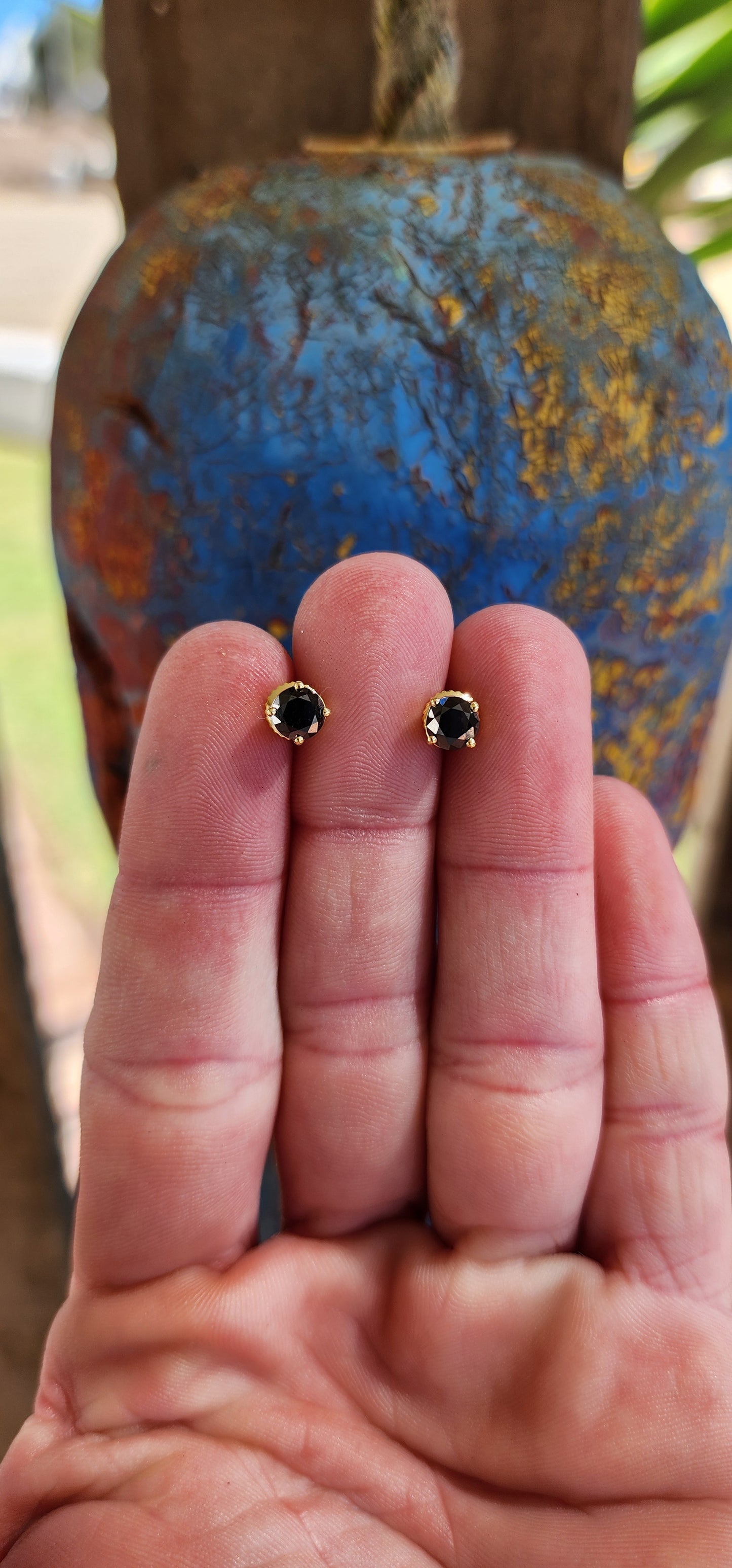 These stunning 9ct Yellow Gold and Round cut Black Diamond Solitaire stud earrings are a perfect blend of elegance and sophistication, designed to make a bold statement.