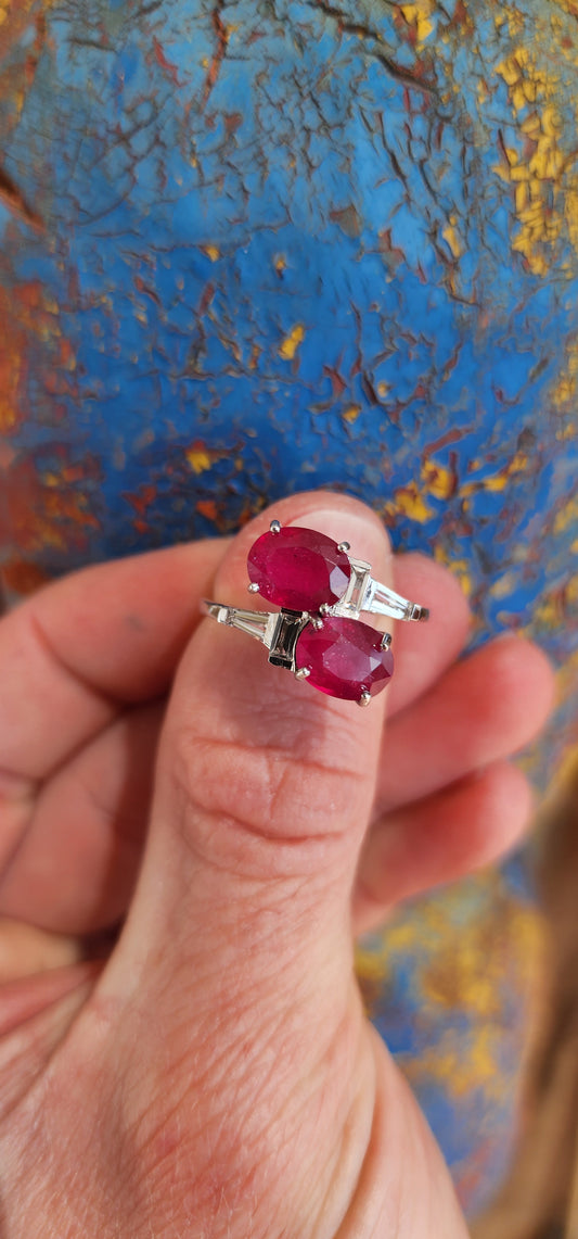 Beyond gorgeous, this trilogy style Oval cut Rubellite Tourmaline ring studded with Baguette cut CZ Gemstones along the Sterling Silver band would make a divine engagement ring.