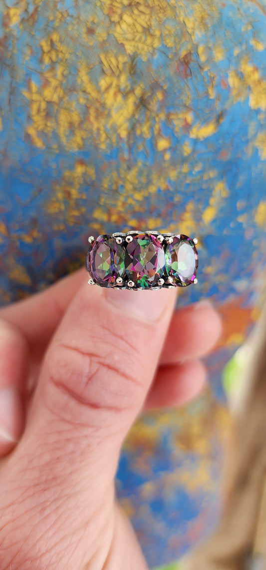 Gorgeous Sterling Silver and Mystic Topaz Gemstones Trilogy ring.This lovely statement ring showcases three enchanting Oval cut Mystic Topaz Gemstones set in prongs.