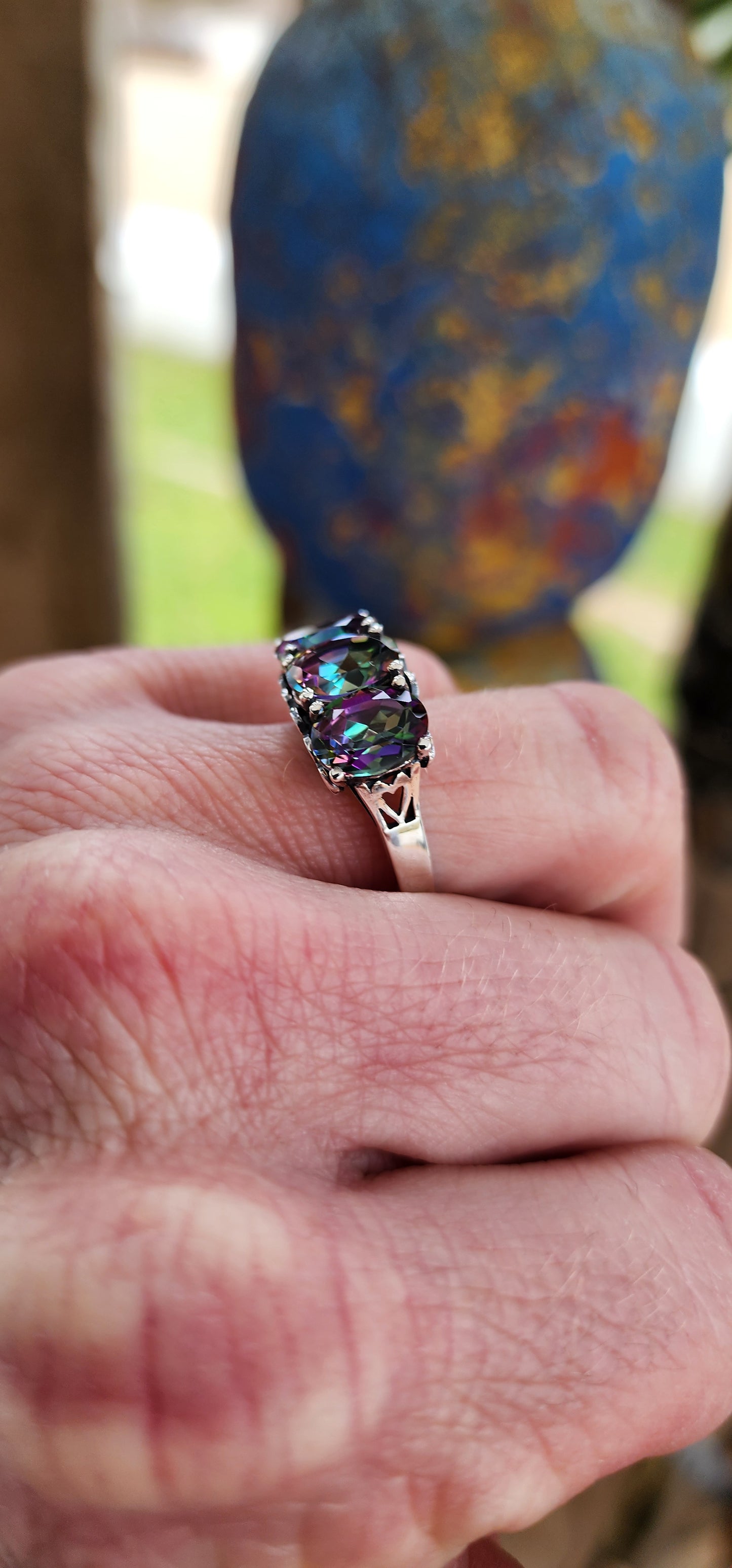 Gorgeous Sterling Silver and Mystic Topaz Gemstones Trilogy ring.This lovely statement ring showcases three enchanting Oval cut Mystic Topaz Gemstones set in prongs.