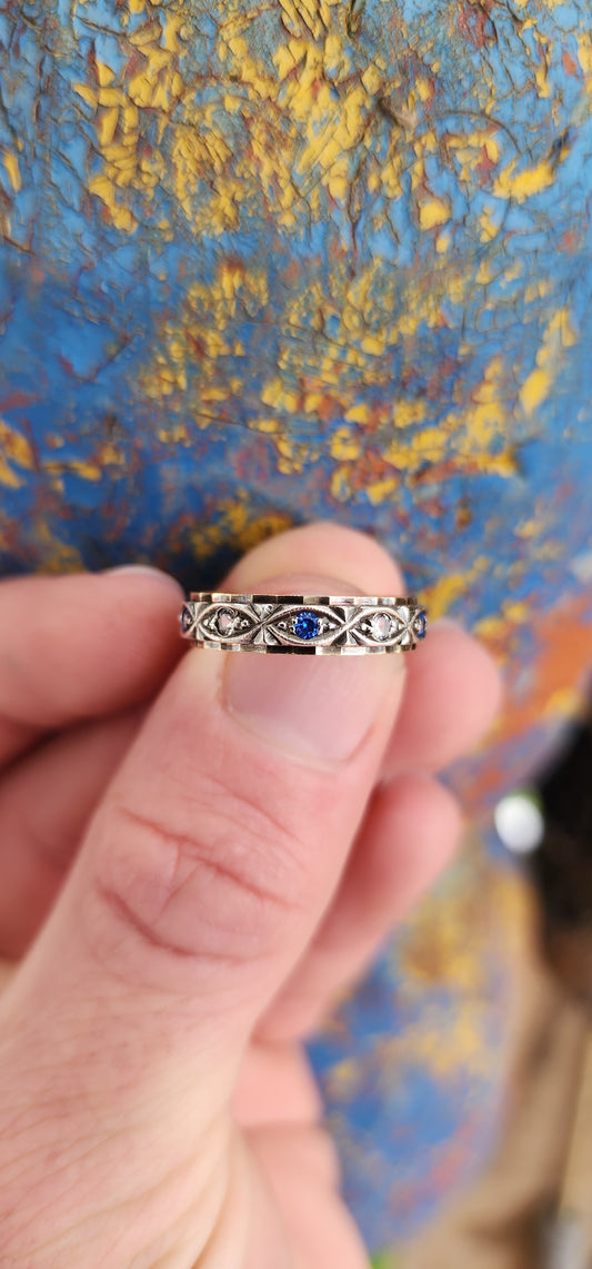 Antique Art Deco circa 1920's 9ct Yellow Gold & Silver Full Eternity ring prong set with Blue and Clear Round cut Spinel Gemstones in decorative Marquise shaped frames.