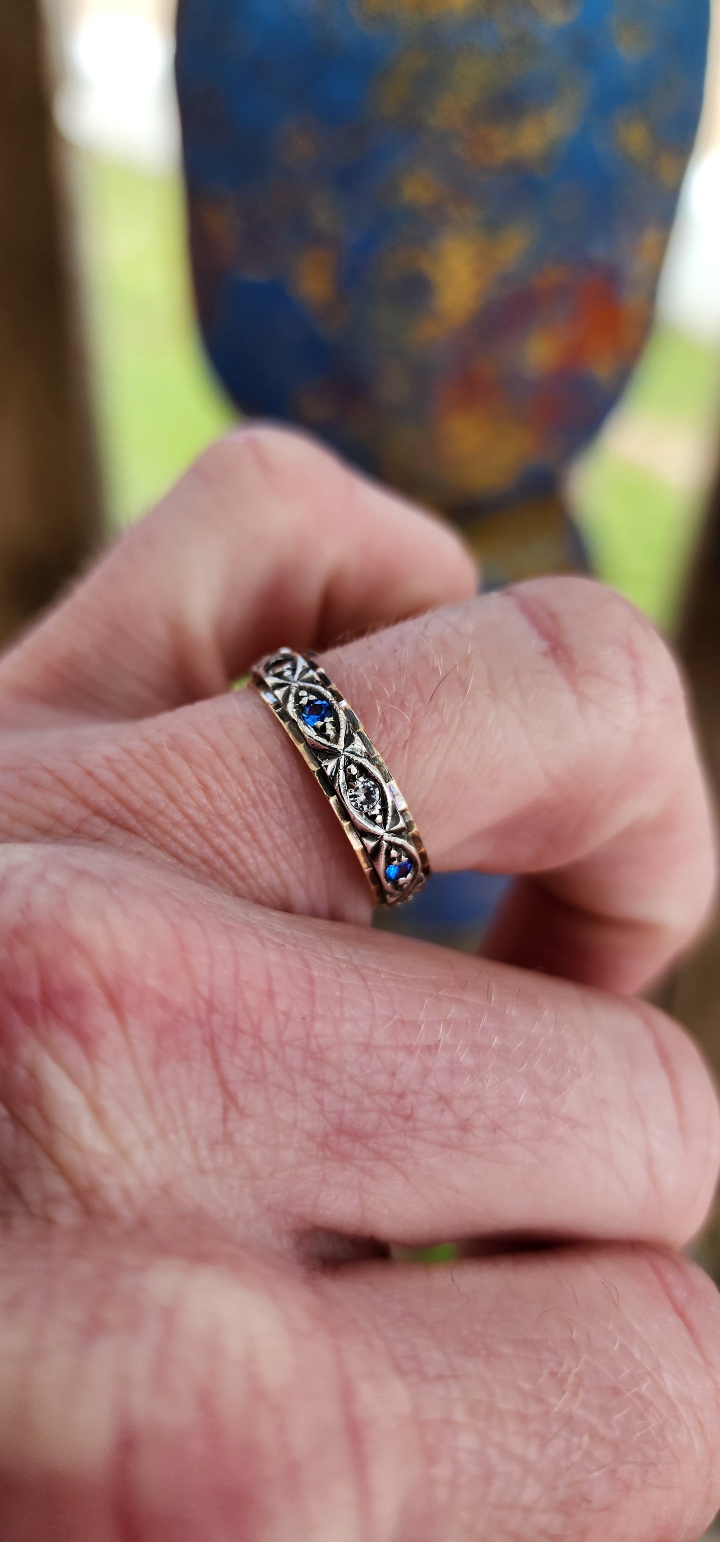 Antique Art Deco circa 1920's 9ct Yellow Gold & Silver Full Eternity ring prong set with Blue and Clear Round cut Spinel Gemstones in decorative Marquise shaped frames.