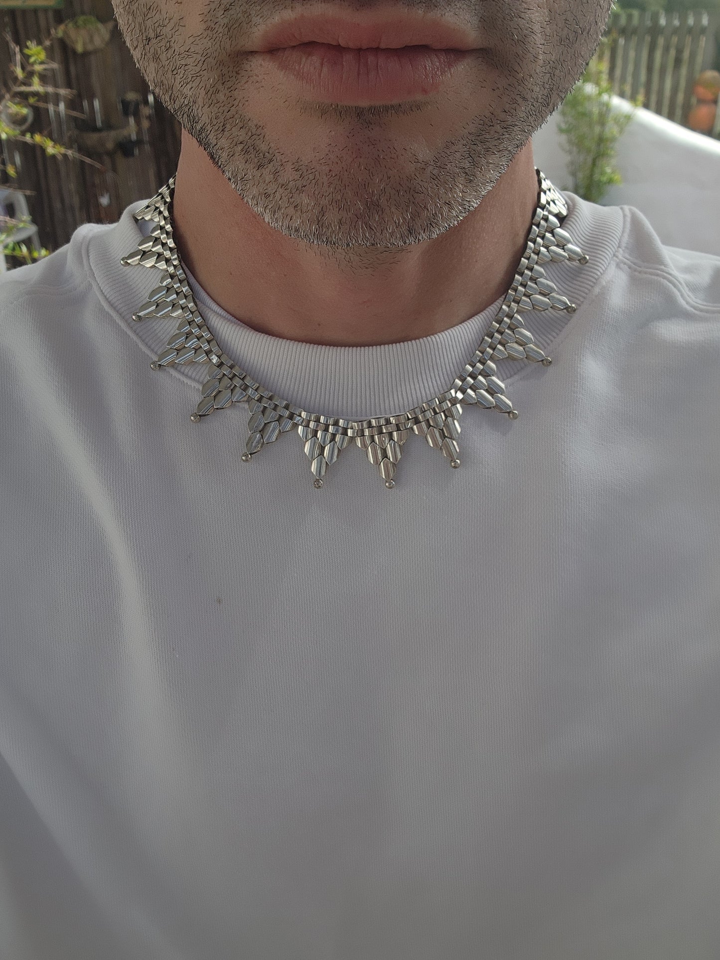 This gorgeous Antique circa 1880's Victorian Hallmarked Silver Etruscan revival articulated book chain collar necklace is made of intricate alternating links with cascading Triangular drops accented with orb edging.