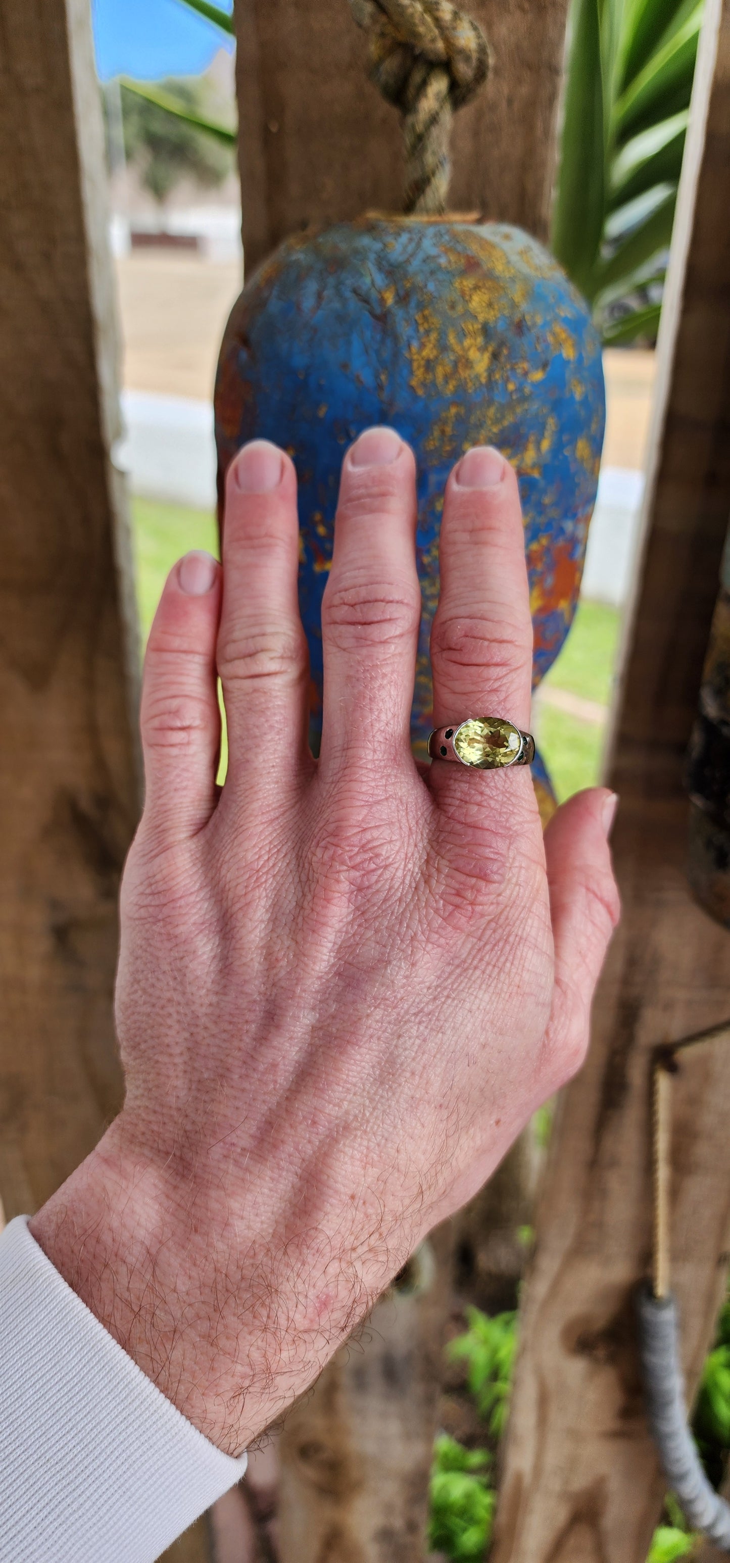 A fantastic Lemon Quartz Color is the perfect embodiment of Spring in this ring. This lovely Sterling ring showcases a Solitaire style with a Oval faceted cut and Channel set Lemon Quartz Gemstone in the centre.