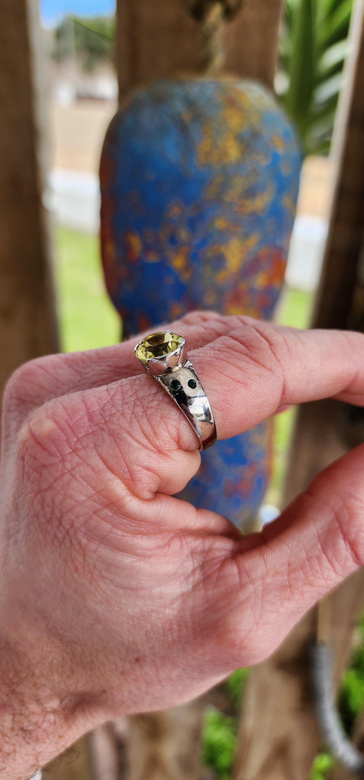 A fantastic Lemon Quartz Color is the perfect embodiment of Spring in this ring. This lovely Sterling ring showcases a Solitaire style with a Oval faceted cut and Channel set Lemon Quartz Gemstone in the centre.