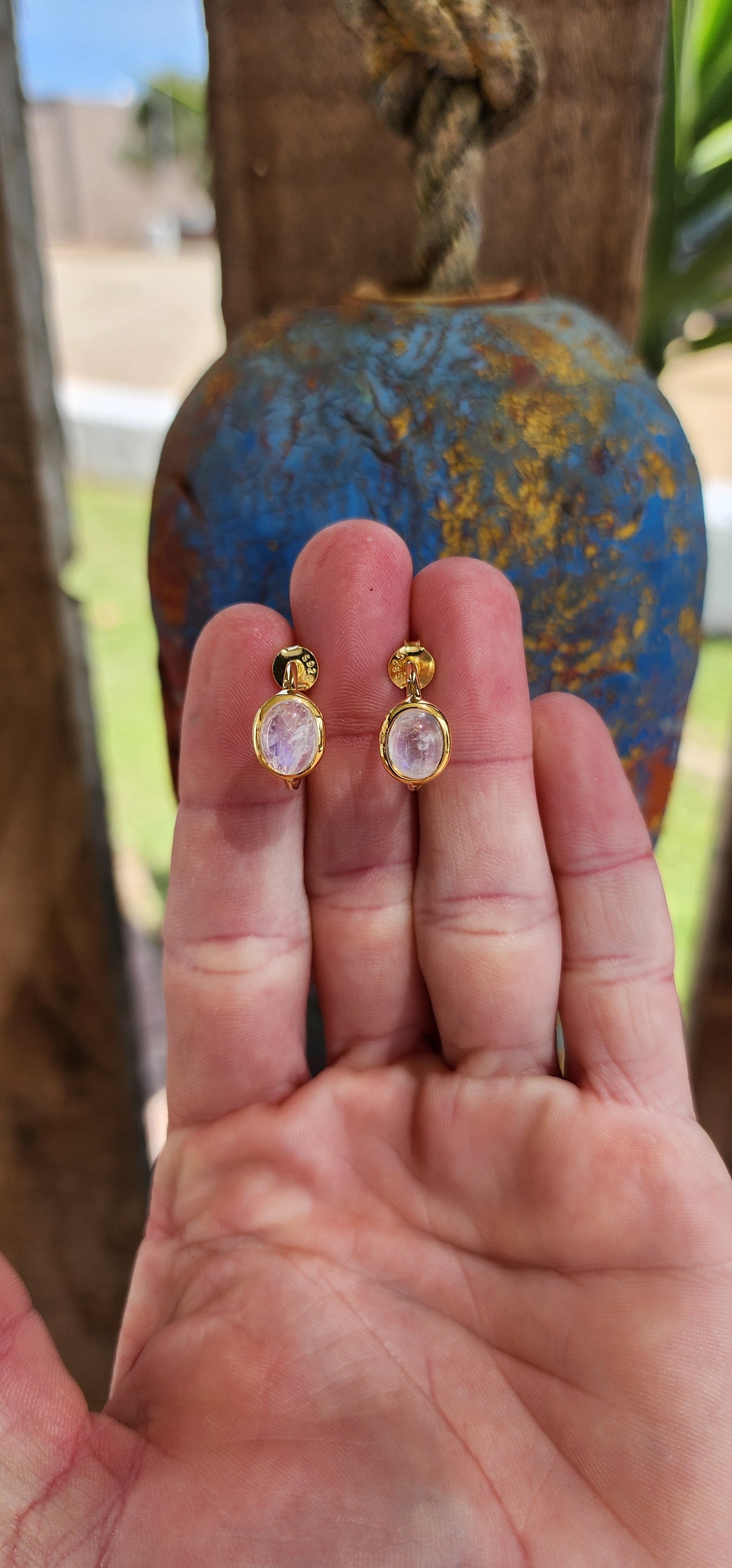 These are absolutely fantastic !! A pair of half hoop stud earrings with a modernistic design, made of Sterling Silver and plated with 18ct Yellow Gold. Each earring features a Oval cut  Moonstone Cabochon set in a bezel/tube setting.