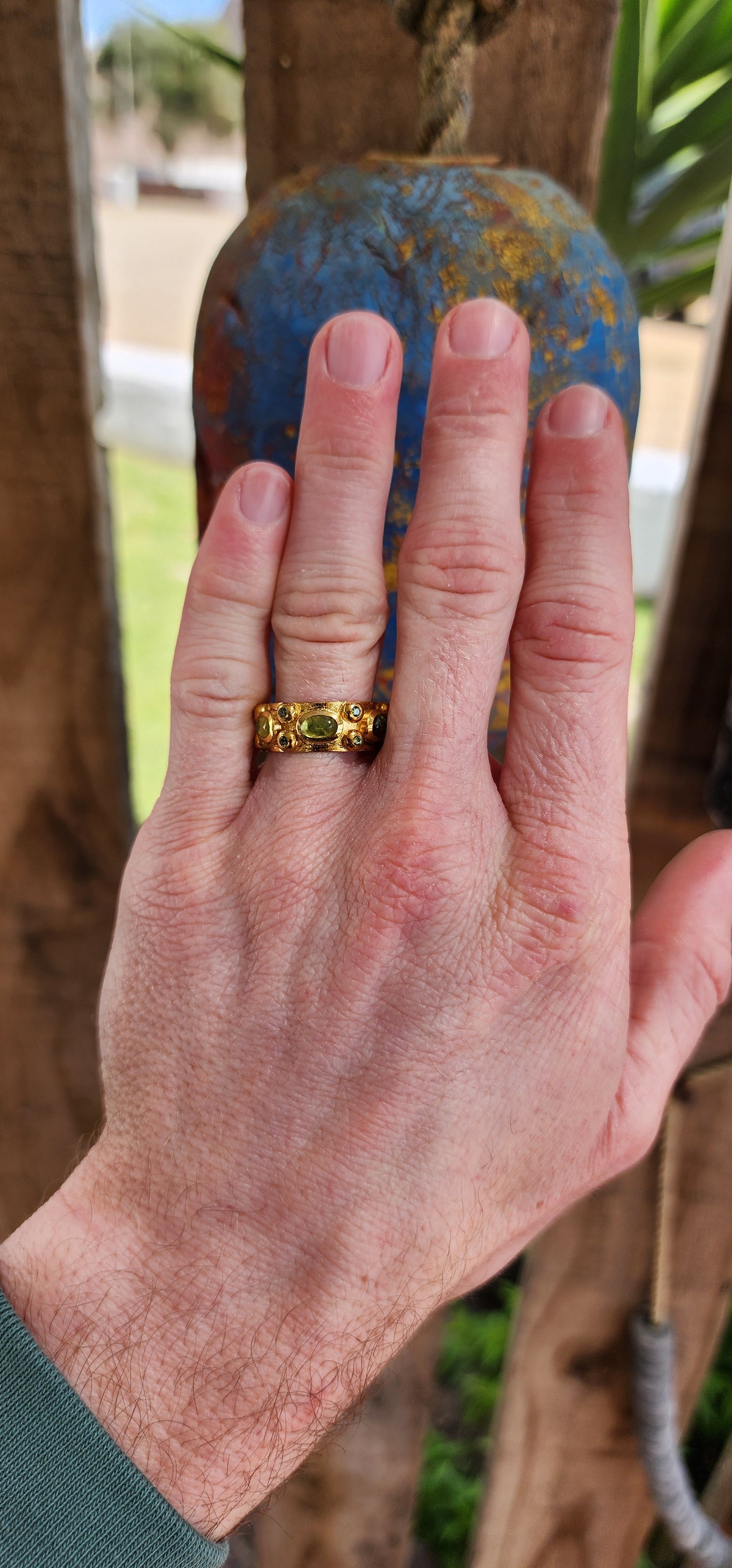 Alluring handmade Sterling Silver and 22ct Yellow Gold plated Peridot Cabochons eternity style ring.Bezel/tube set with 6x Oval Peridot Cabochons and 12x small Round faceted Cut Peridot Gemstones.Perfectly unisex !