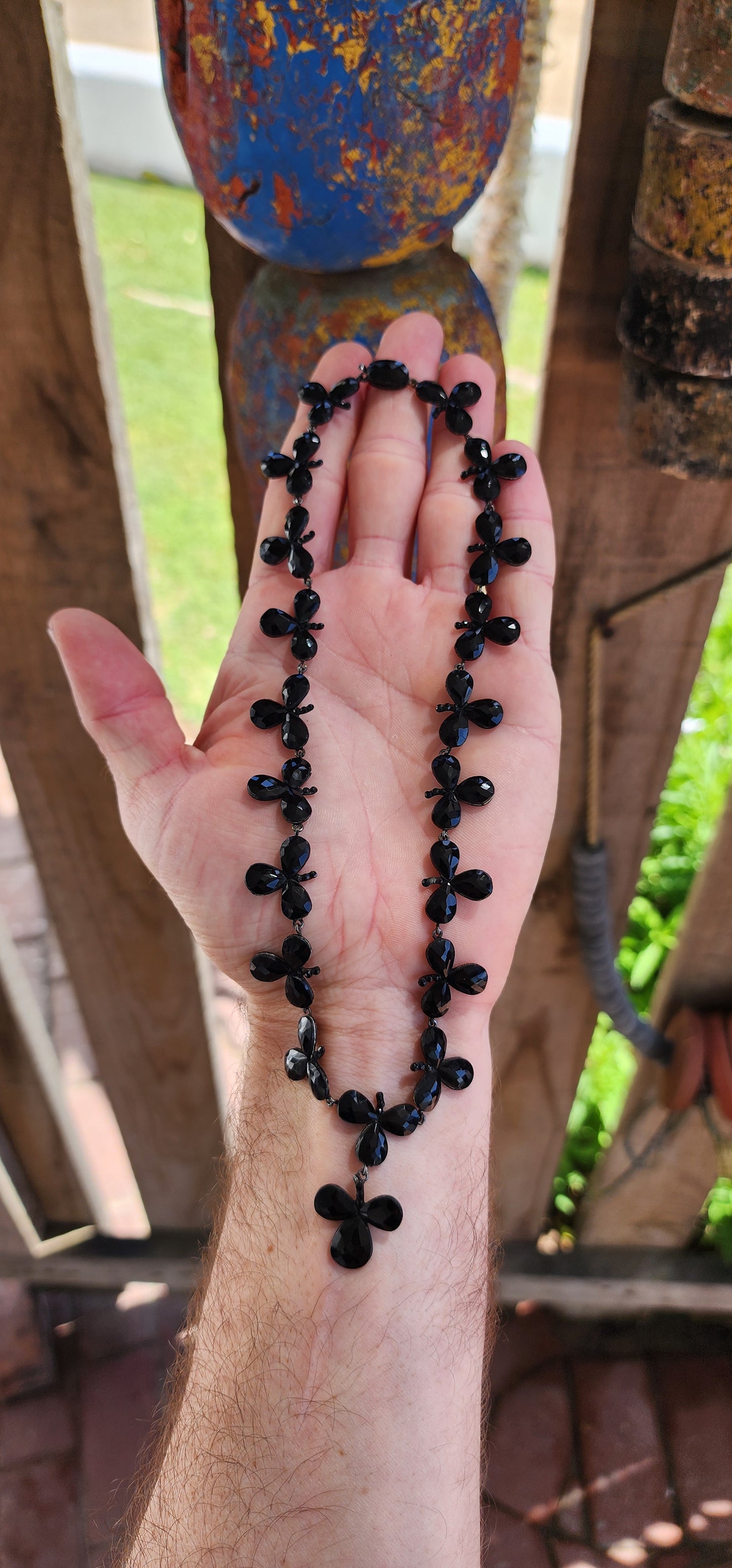 Antique Victorian circa 1880's French Jet trefoil Riviere style necklace with pendant.
This necklace is an exquisite example of Victorian mourning jewelry, specifically from the 1880s.