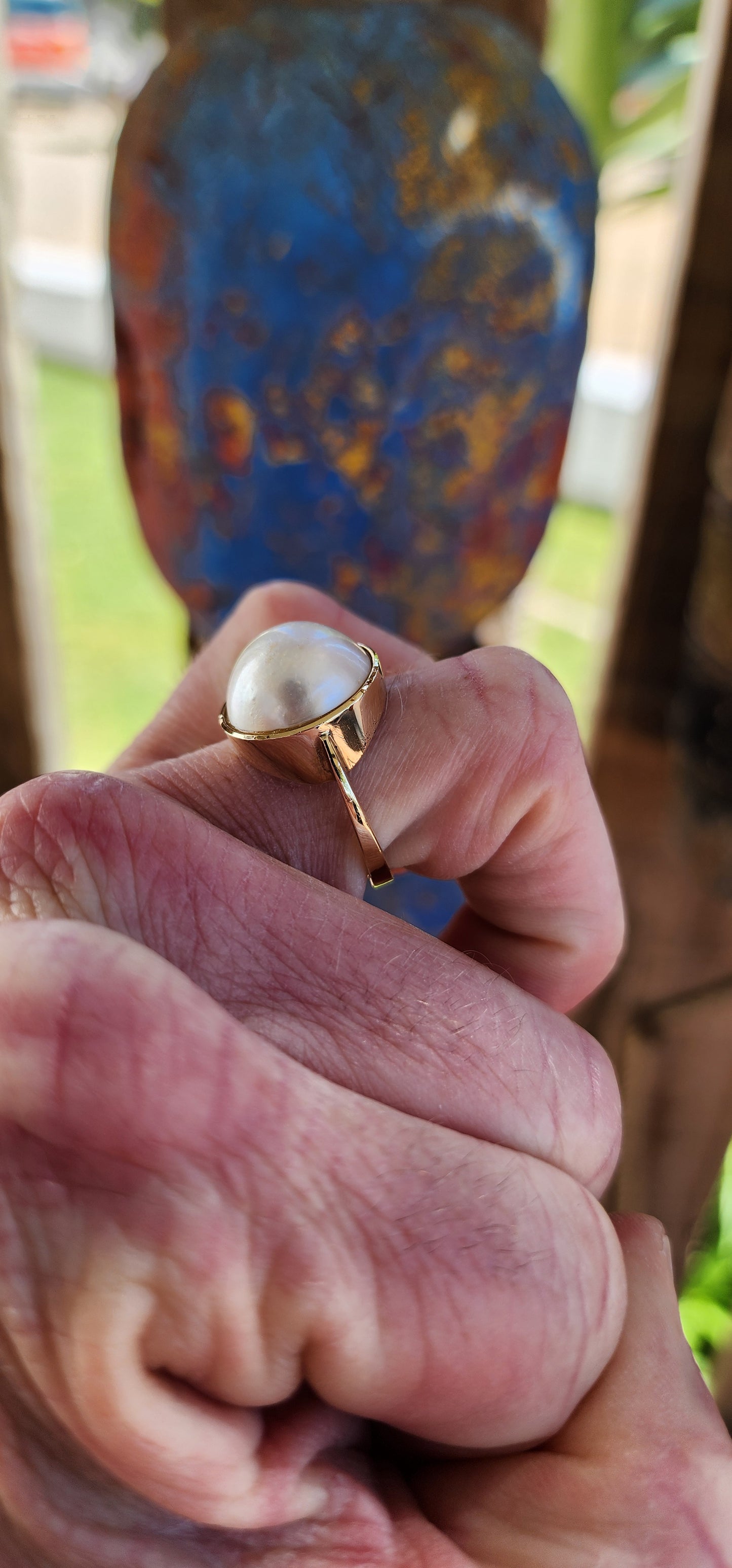 Stunning Vintage ring crafted in 9ct yellow gold, featuring a bezel tube setting that holds a large Mabe Pearl.