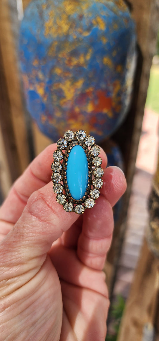 One of a kind upsycled cocktail ring converted from an Antique Victorian Brass , faux Turquoise glass and clear Rhinesrones brooch.