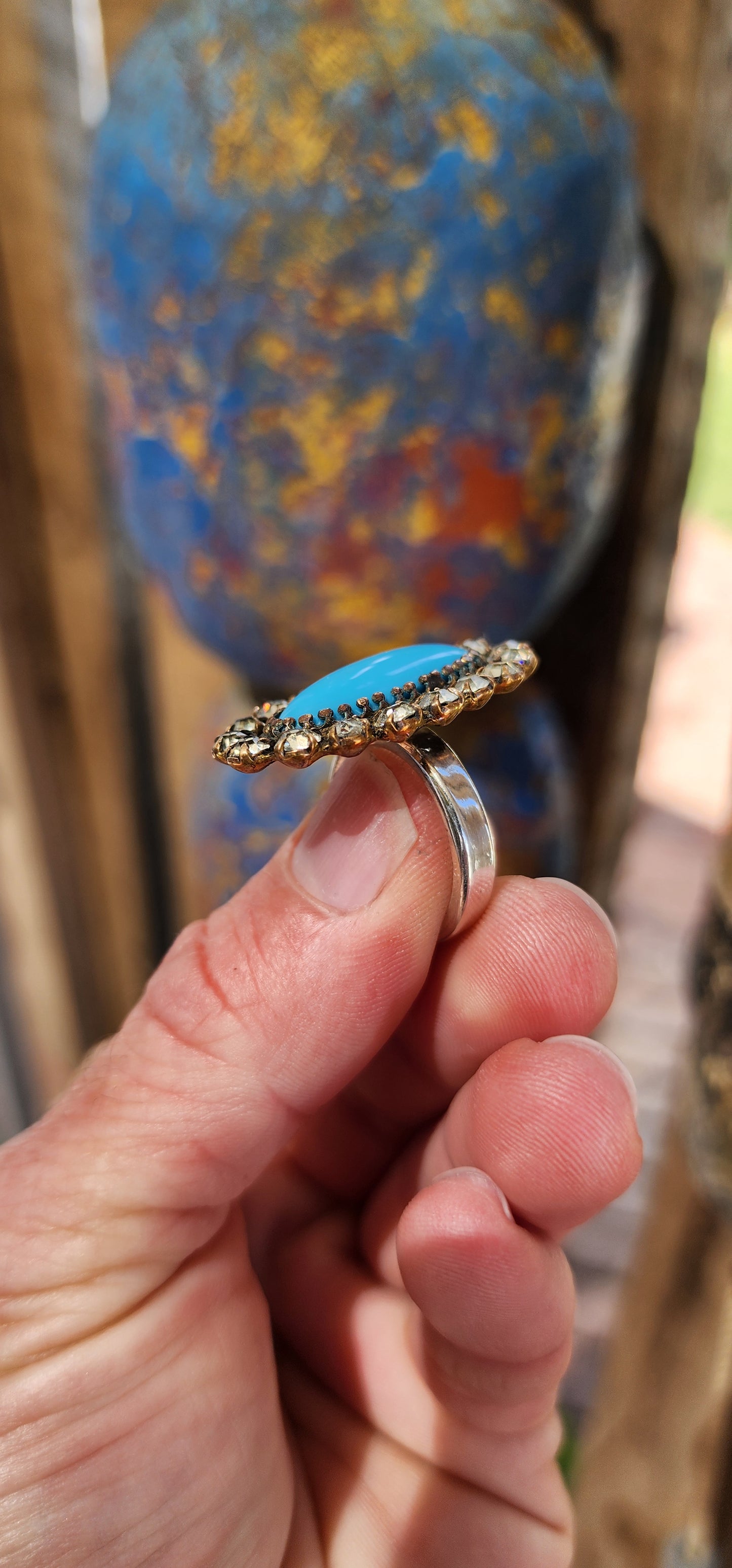 One of a kind upsycled cocktail ring converted from an Antique Victorian Brass , faux Turquoise glass and clear Rhinesrones brooch.