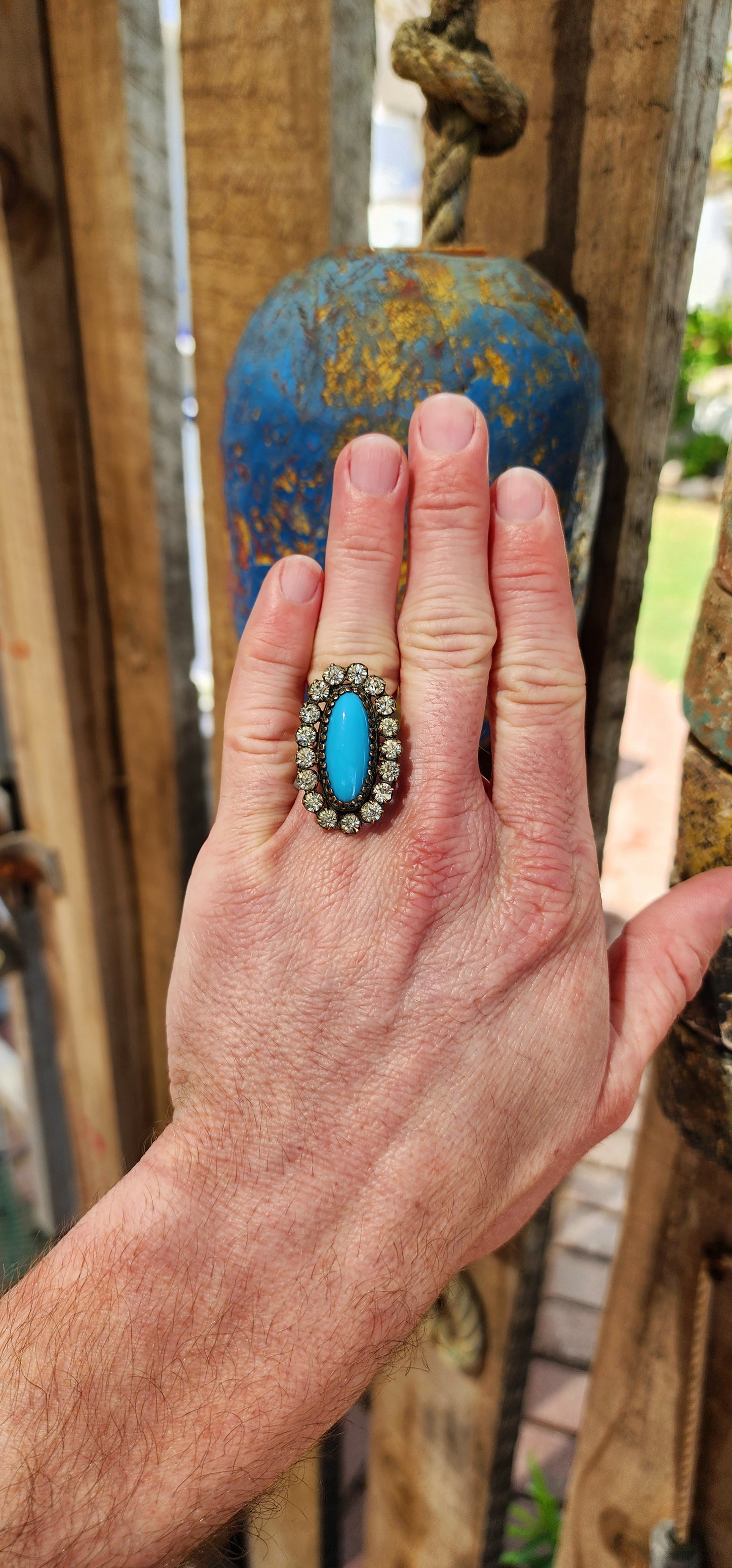 One of a kind upsycled cocktail ring converted from an Antique Victorian Brass , faux Turquoise glass and clear Rhinesrones brooch.