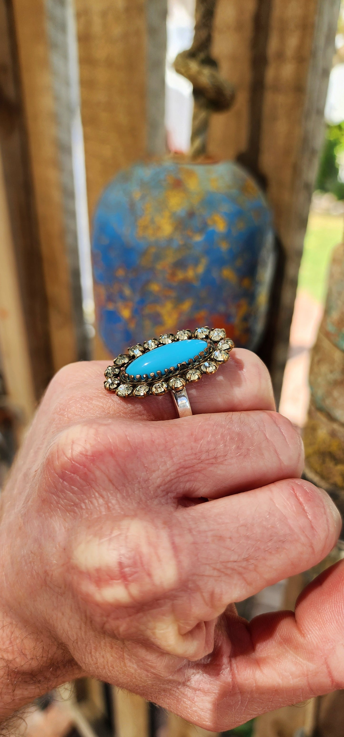 One of a kind upsycled cocktail ring converted from an Antique Victorian Brass , faux Turquoise glass and clear Rhinesrones brooch.