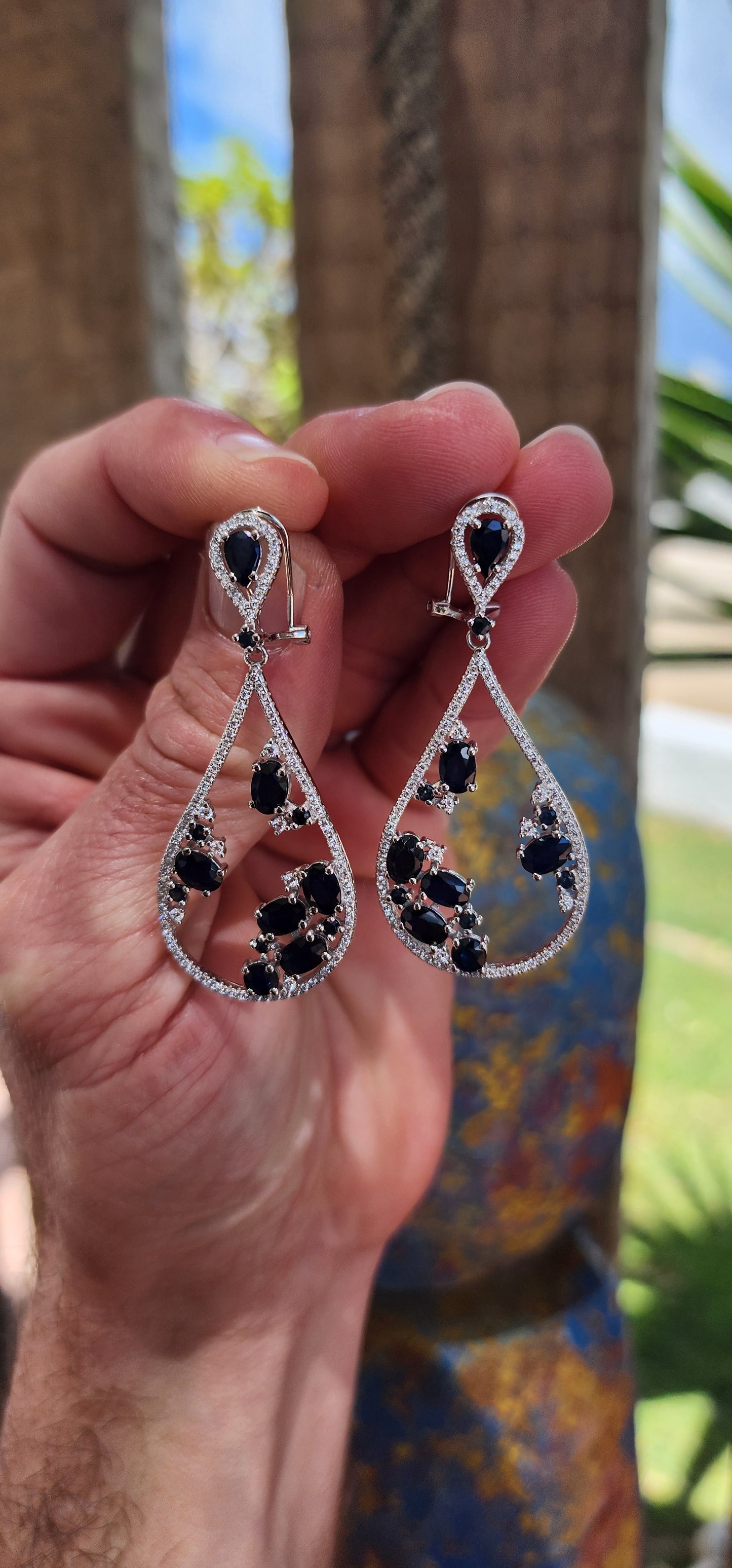 These generous in size sterling silver push-in earrings are showstoppers, dripping with opulence and bold sophistication.