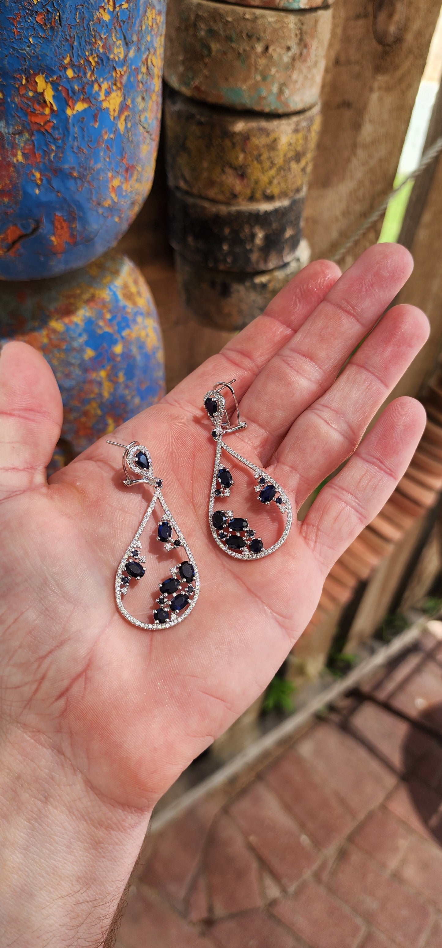 These generous in size sterling silver push-in earrings are showstoppers, dripping with opulence and bold sophistication.