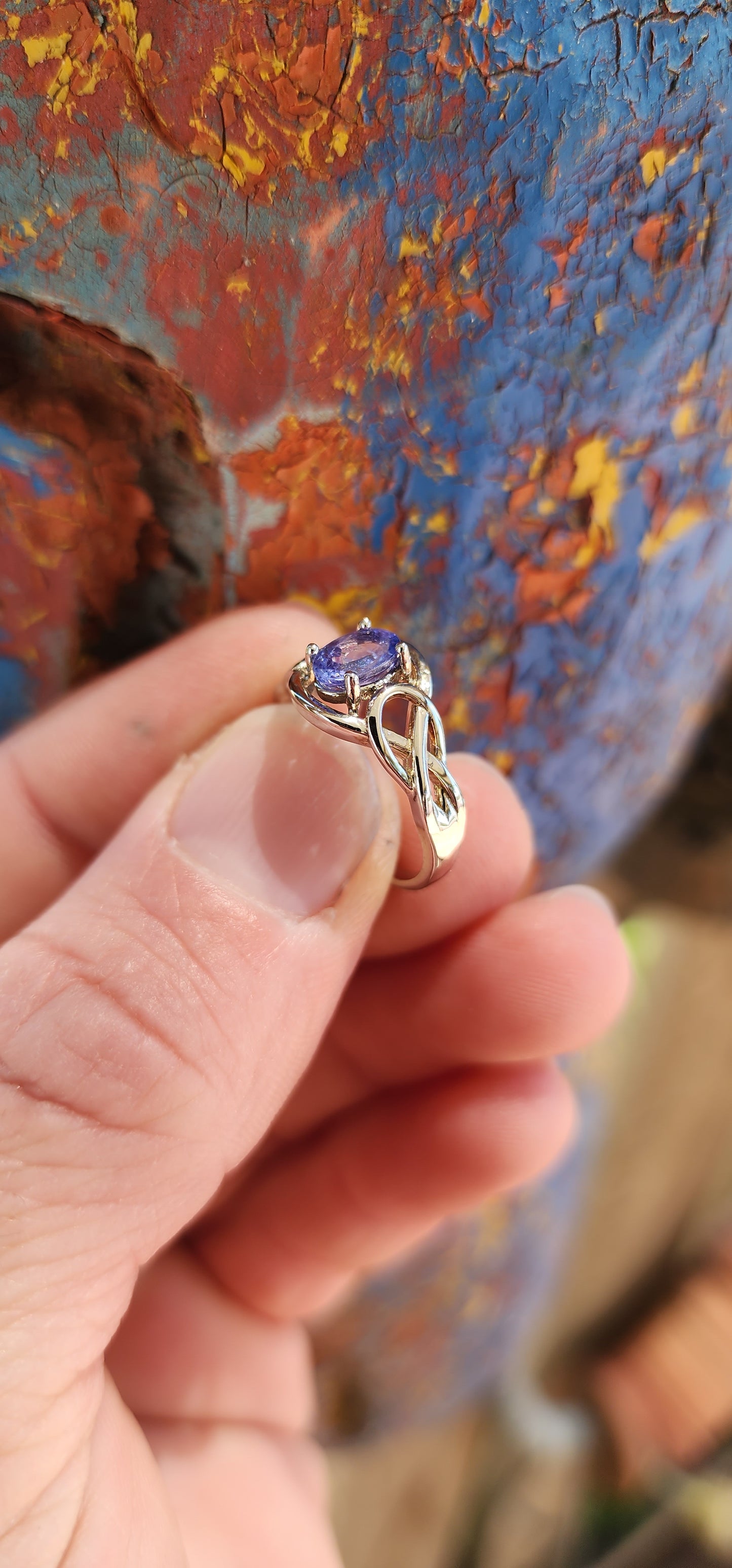 Romantic Sterling silver and Tanzanite infinty love knot ring.