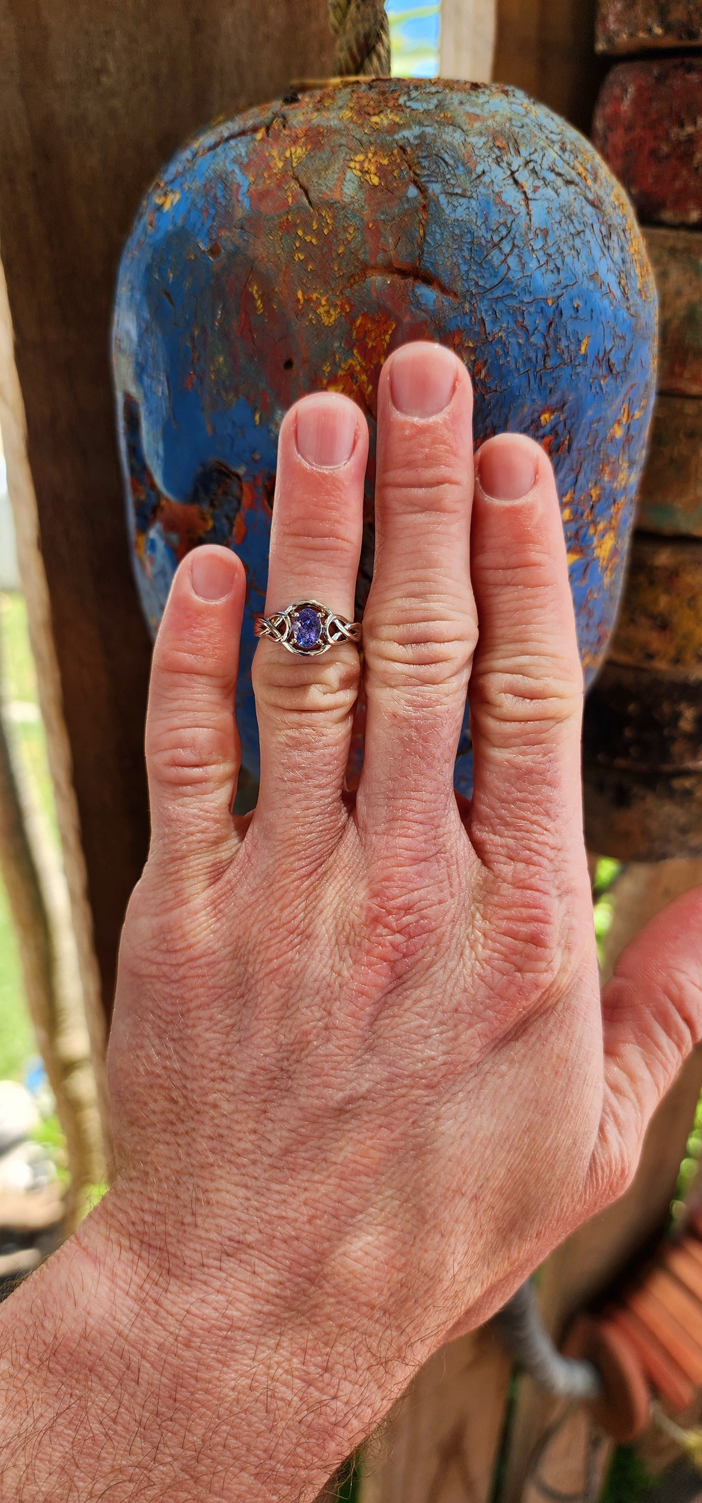 Romantic Sterling silver and Tanzanite infinty love knot ring.