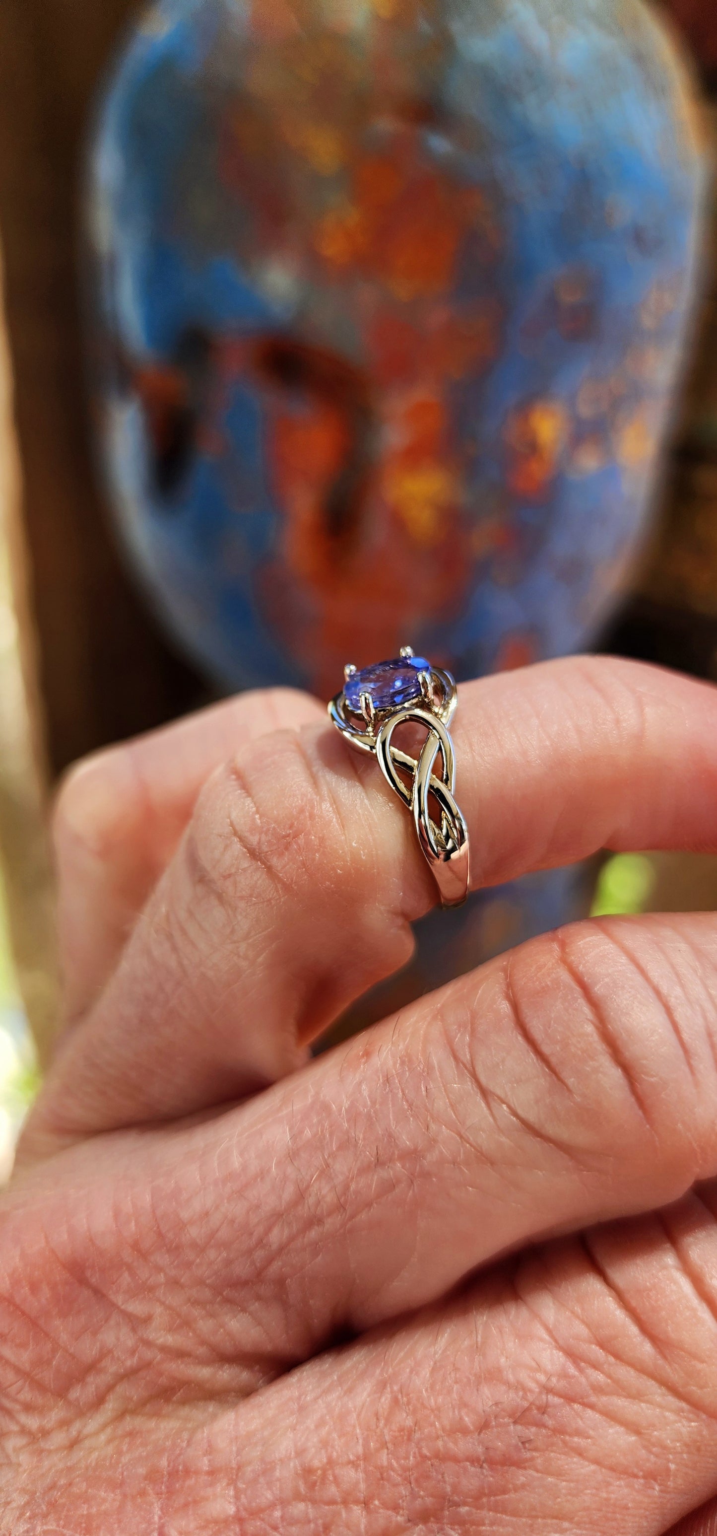 Romantic Sterling silver and Tanzanite infinty love knot ring.