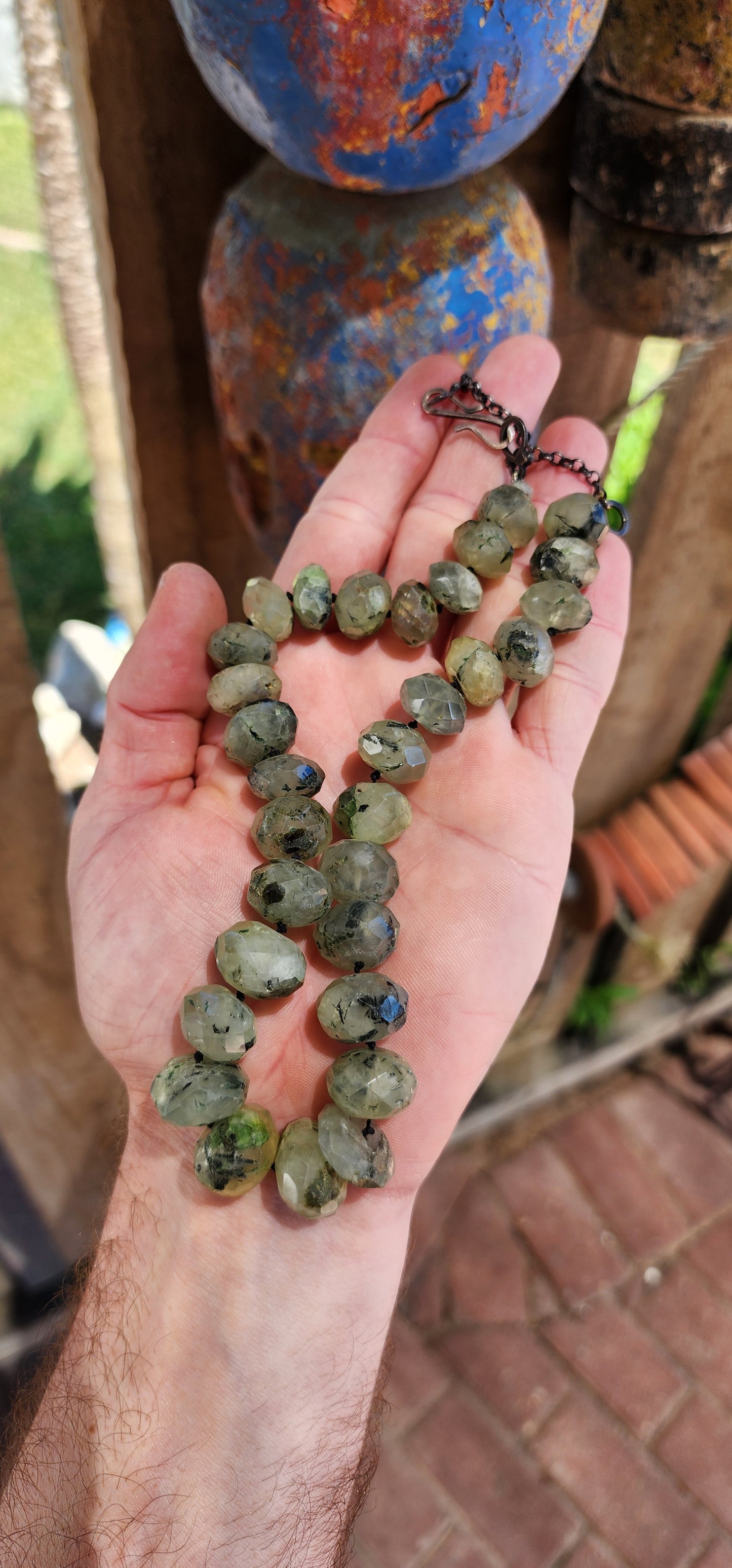 This Prehnite gemstone necklace is a refined piece that highlights the natural allure of the stones through both its design and craftsmanship.