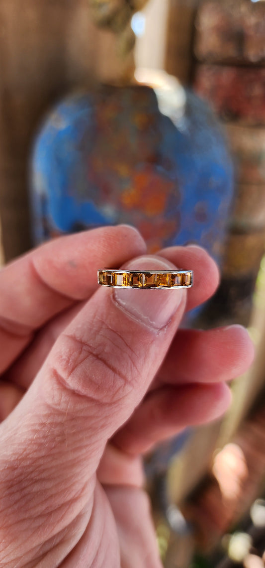 This ring is like a band of sunshine for your finger, perfectly crafted with vibrant, honey-gold Citrine Gemstones that sparkle like captured rays of light.